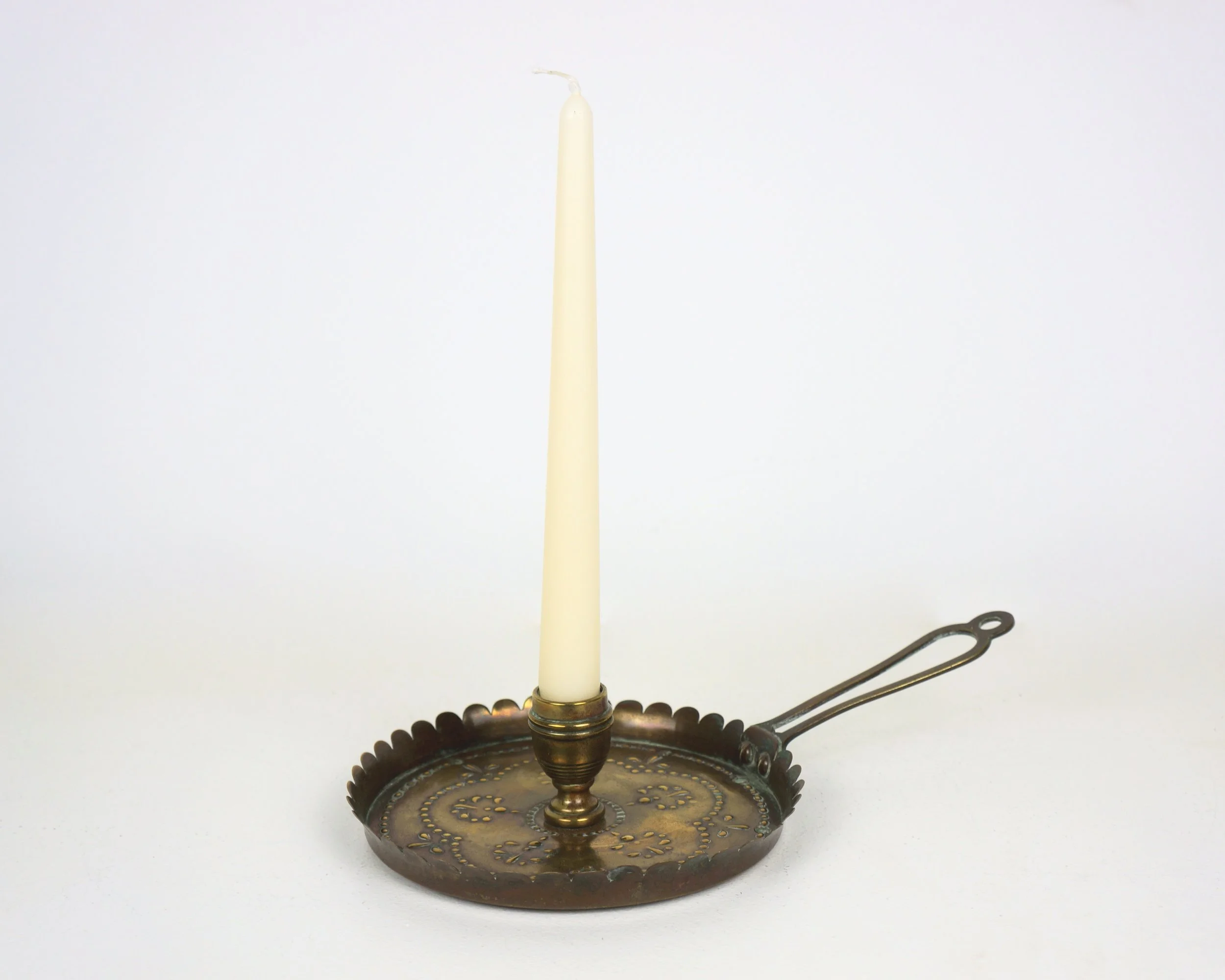 AN ARTS AND CRAFTS CANDLESTICK