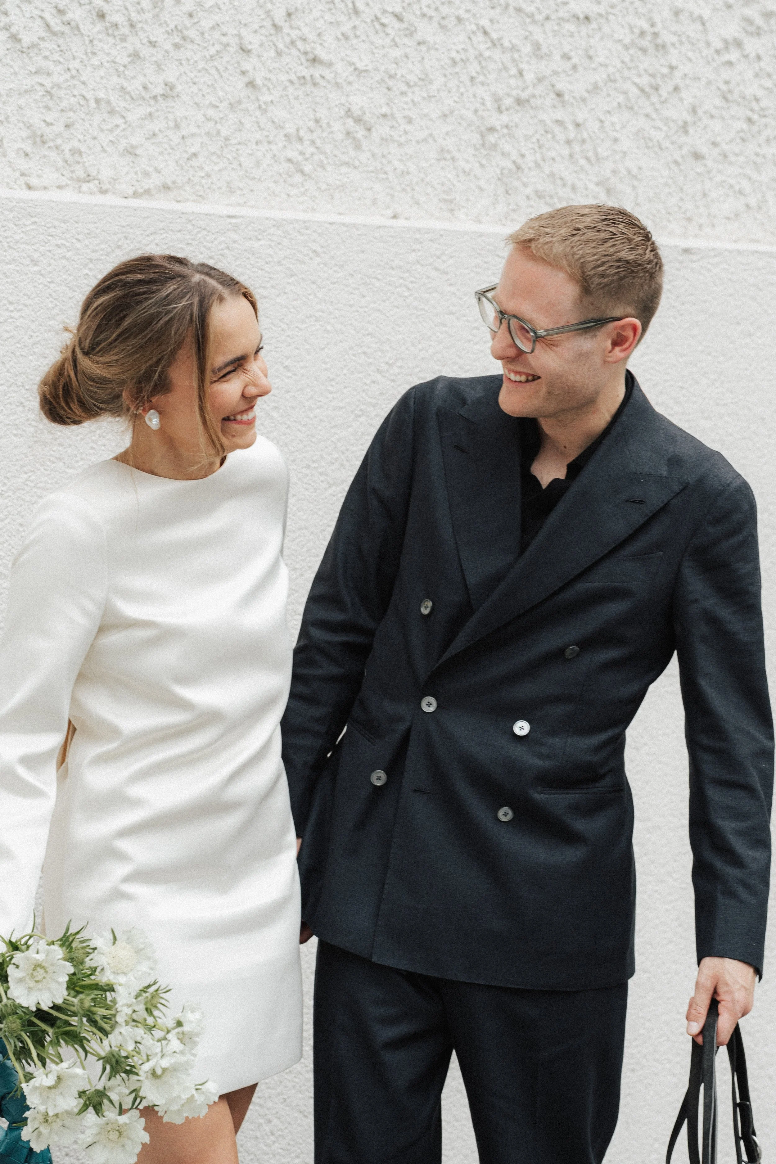 wedding-couple-laughing-wall-civil-wedding-munich-mandlstrasse-thehotis.wedding-couple-laughing-wall-civil-wedding-munich-mandlstrasse-thehotis.jpg