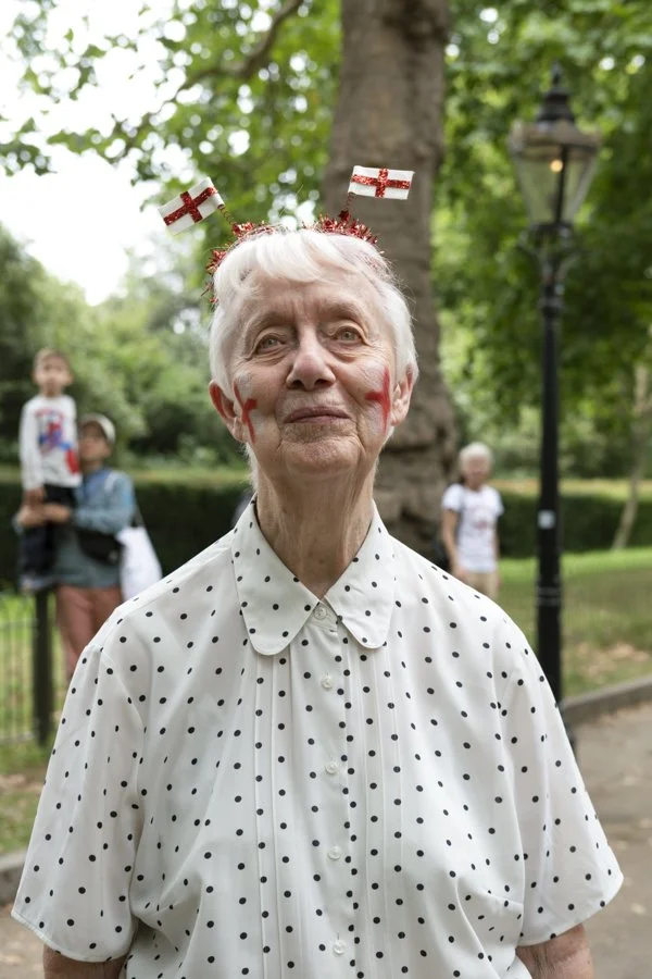 London-documentary-portrait-photographer-elderly-lady-lioness-parade-web-use.jpg