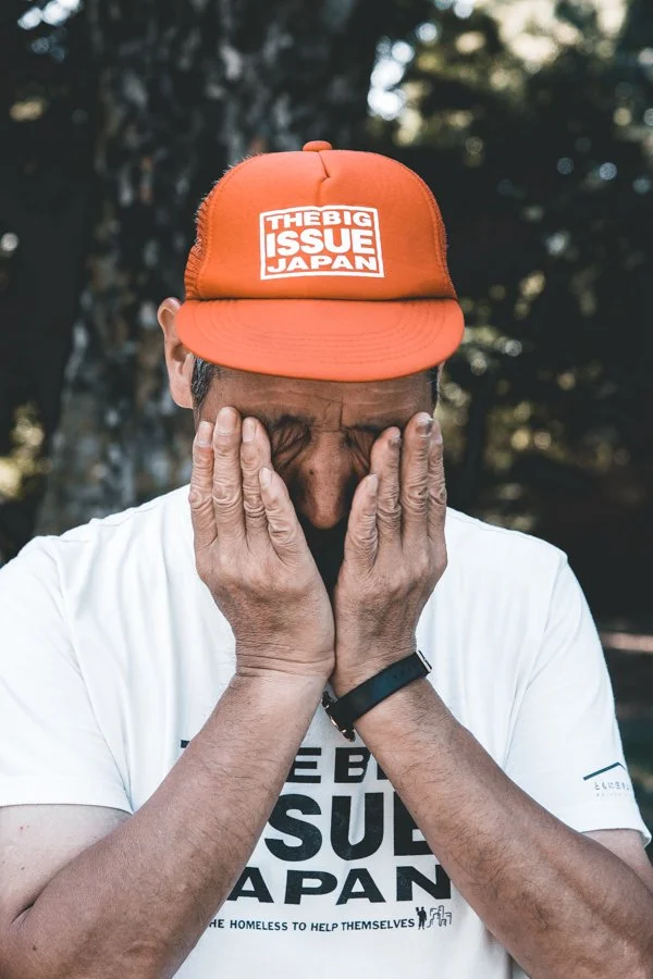 london-documentary-photographer-japan-homeless-man-tired-wearing-big-issue-hat copy.jpg