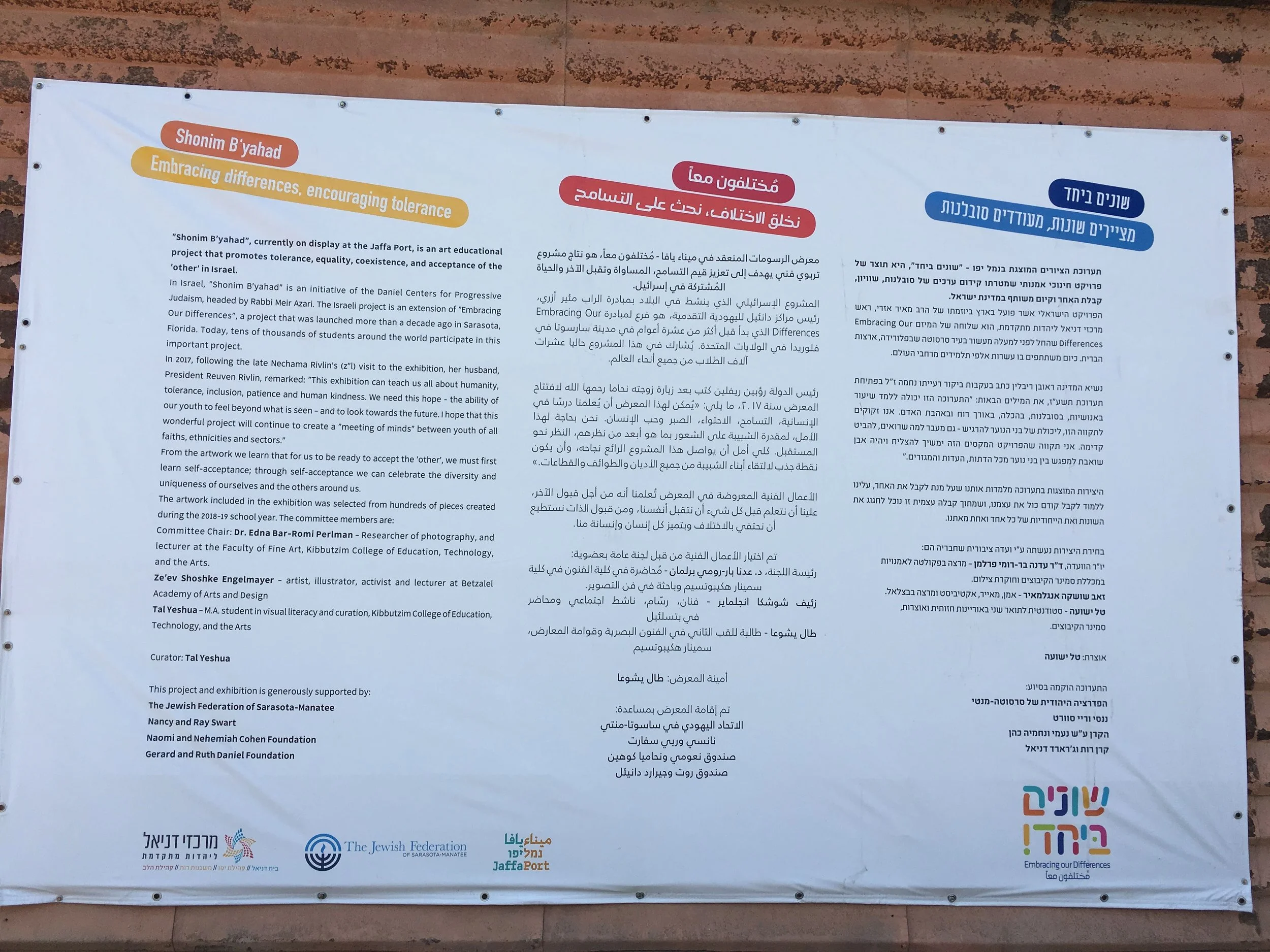 Different together sign. Sign discusses embracing differences and encouraging tolerance in English, Arabic, and Hebrew. Photo by Gili Hammer.