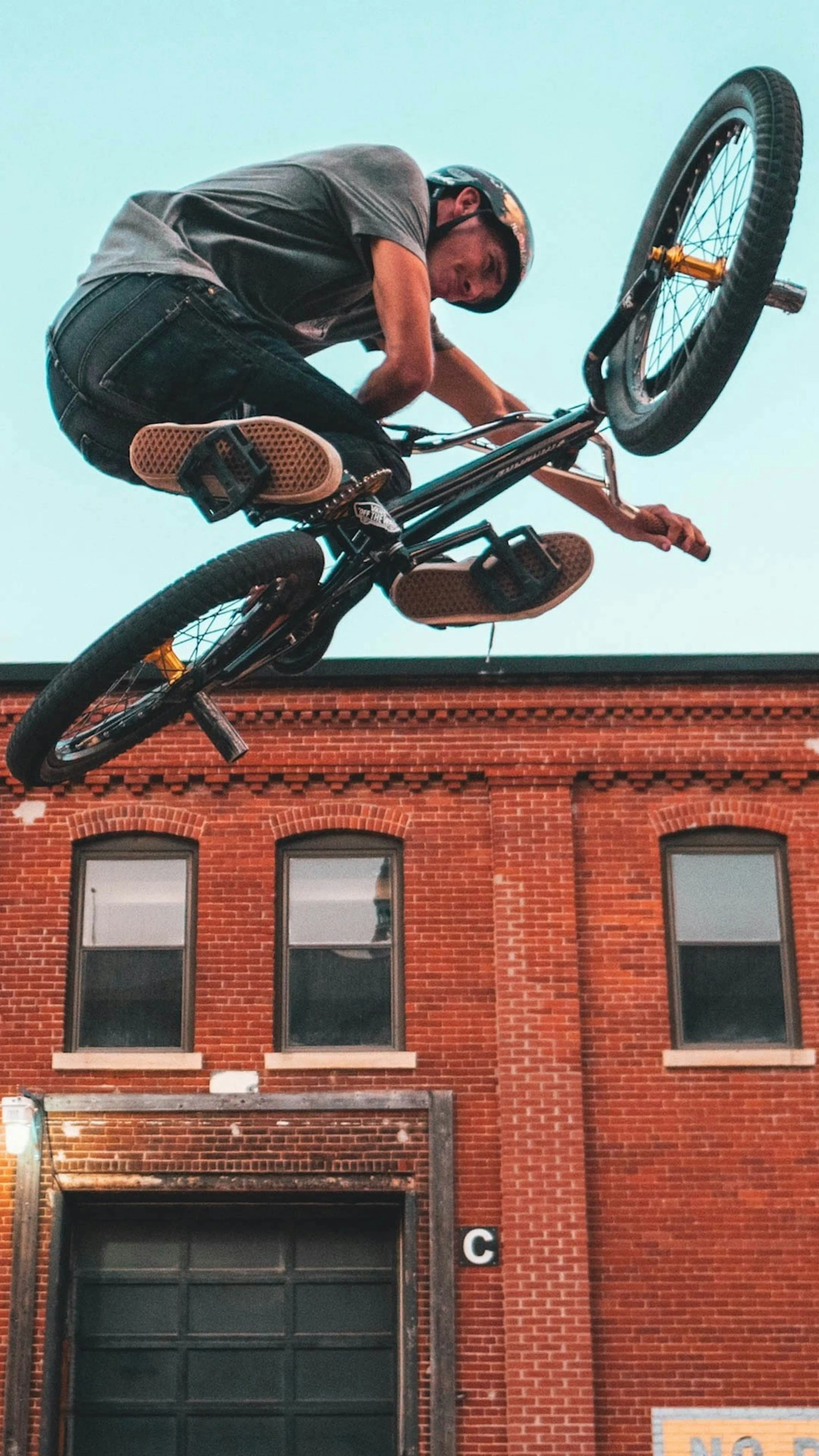 Biker in front of a house