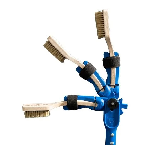 The Beta Brush stick is shown locked at 0, 45 and 90 degree angles to allow you to brush dirt and chalk from bouldering holds whilst bouldering