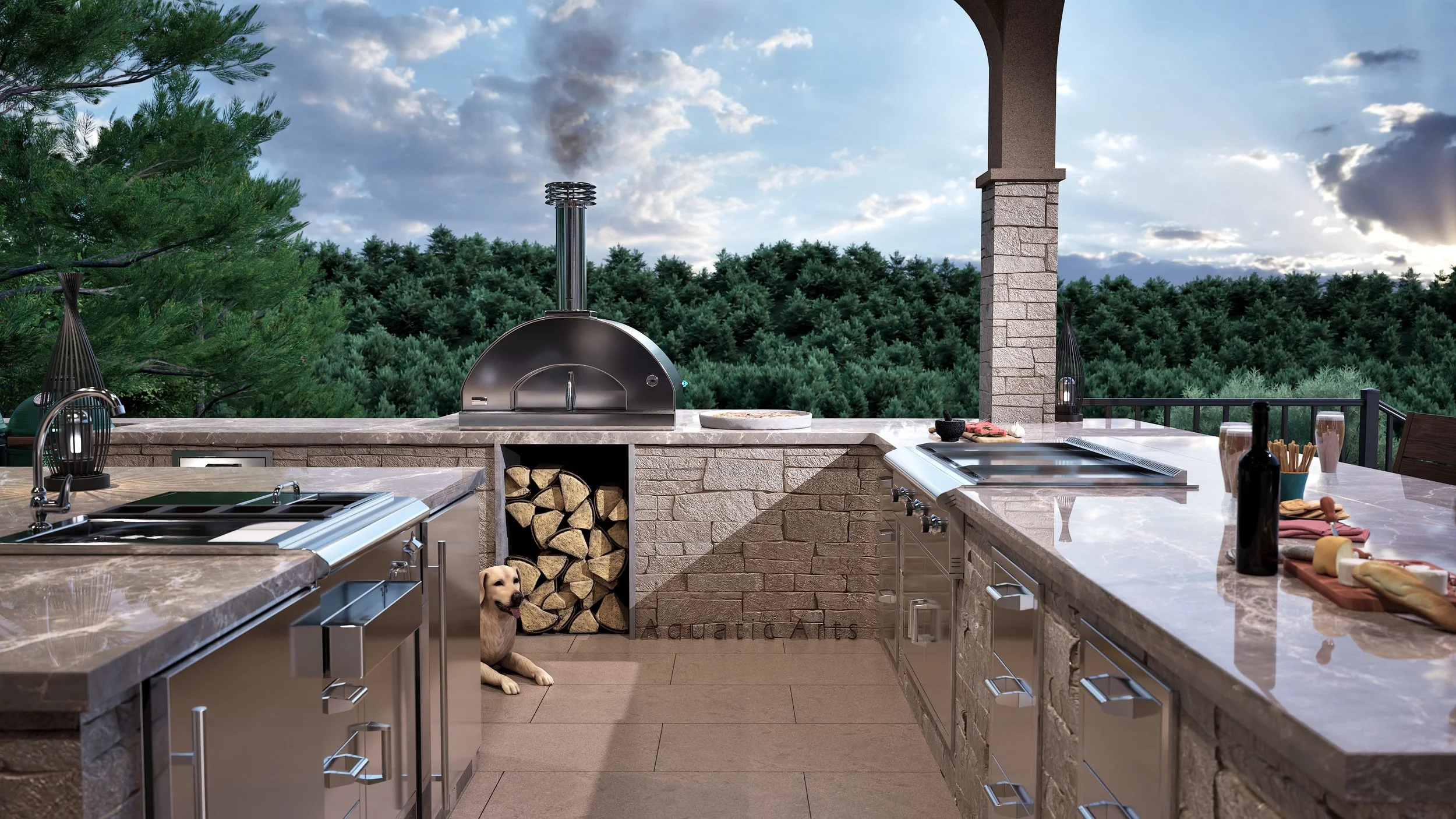 Outdoor kitchen with stone countertops, wood-fired pizza oven, firewood storage, and a dog sitting on the floor. Surrounded by lush trees under a partly cloudy sky.