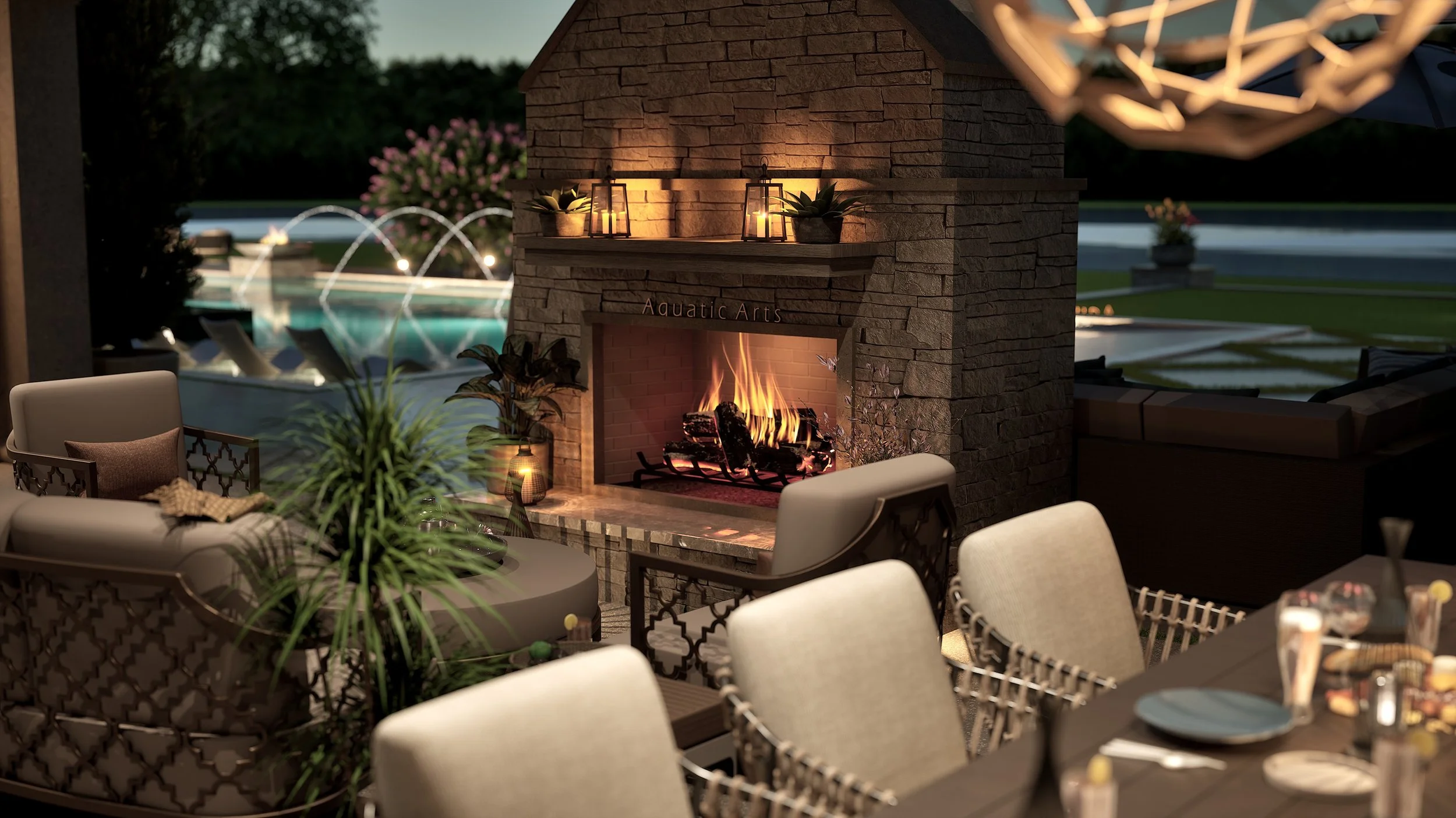 An outdoor patio area with a fireplace, comfortable seating, and a pool with fountains in the background at dusk.