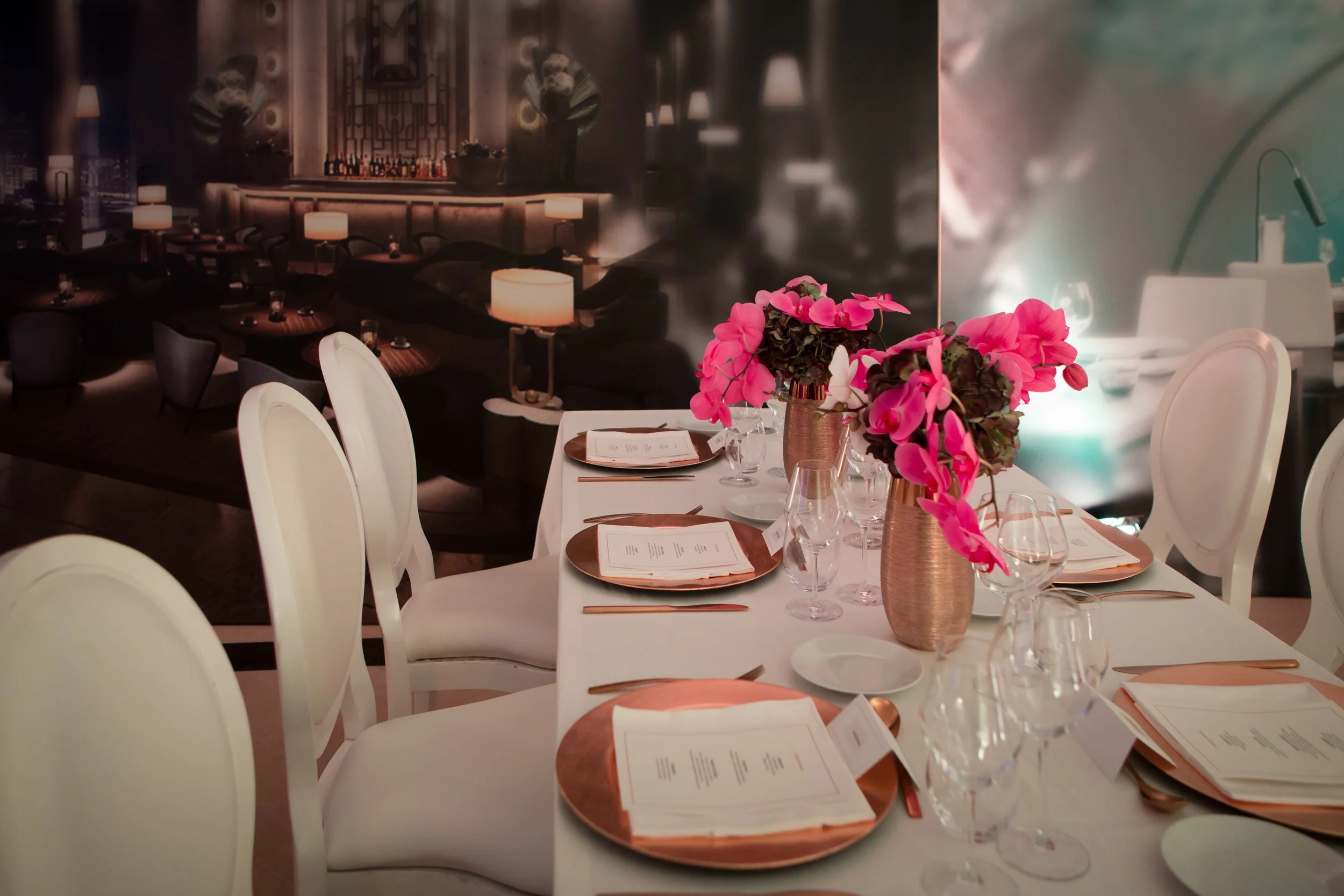 Conrad Hotels ILTM Cannes dining table — copper charger plates, hot pink orchids and floor-to-ceiling property photography, Tiny Penthouse Studio