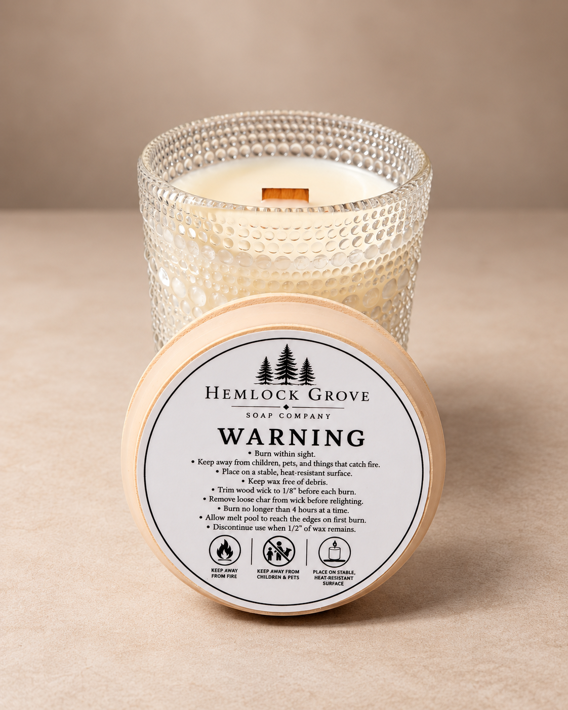Close view of the decorative textured glass finish on the Ro Hus candle.