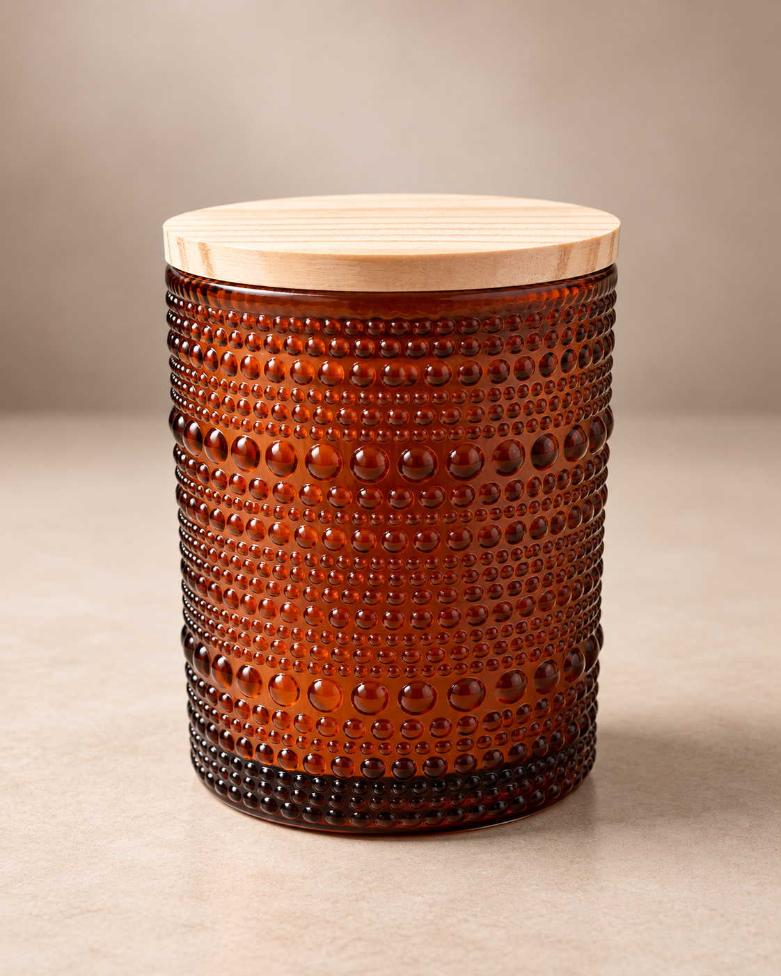 Ro Hus hand-poured candle in amber textured glass with a maple wood wick.