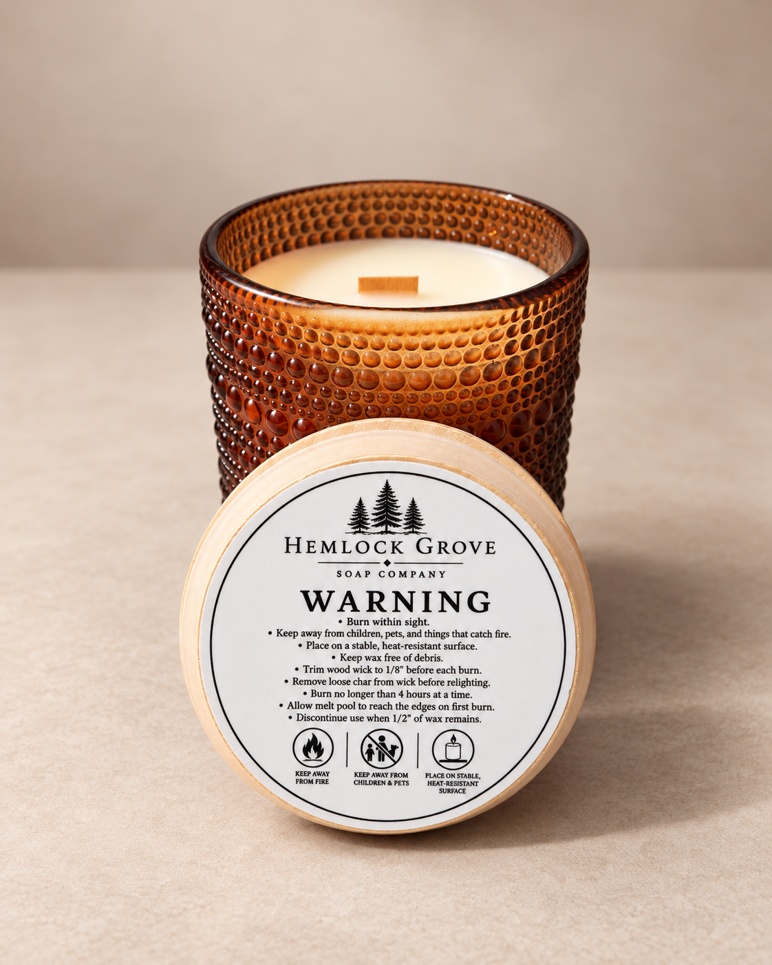 Close view of the decorative textured glass finish on the Ro Hus candle.