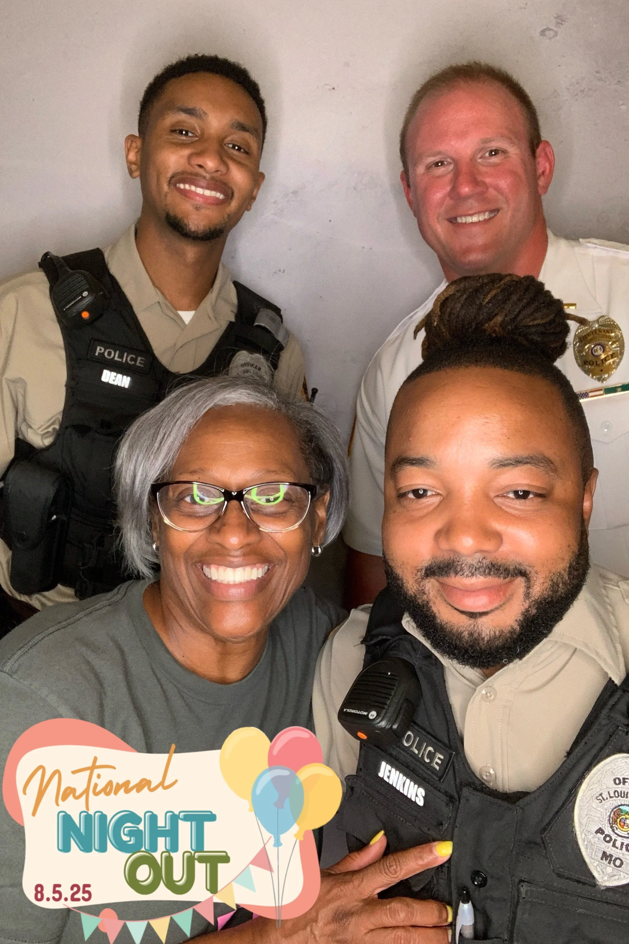 Group of four police officers and a woman smiling, celebrating National Night Out event on August 5, 2025, with a festive graphic overlay including balloons and bunting.
