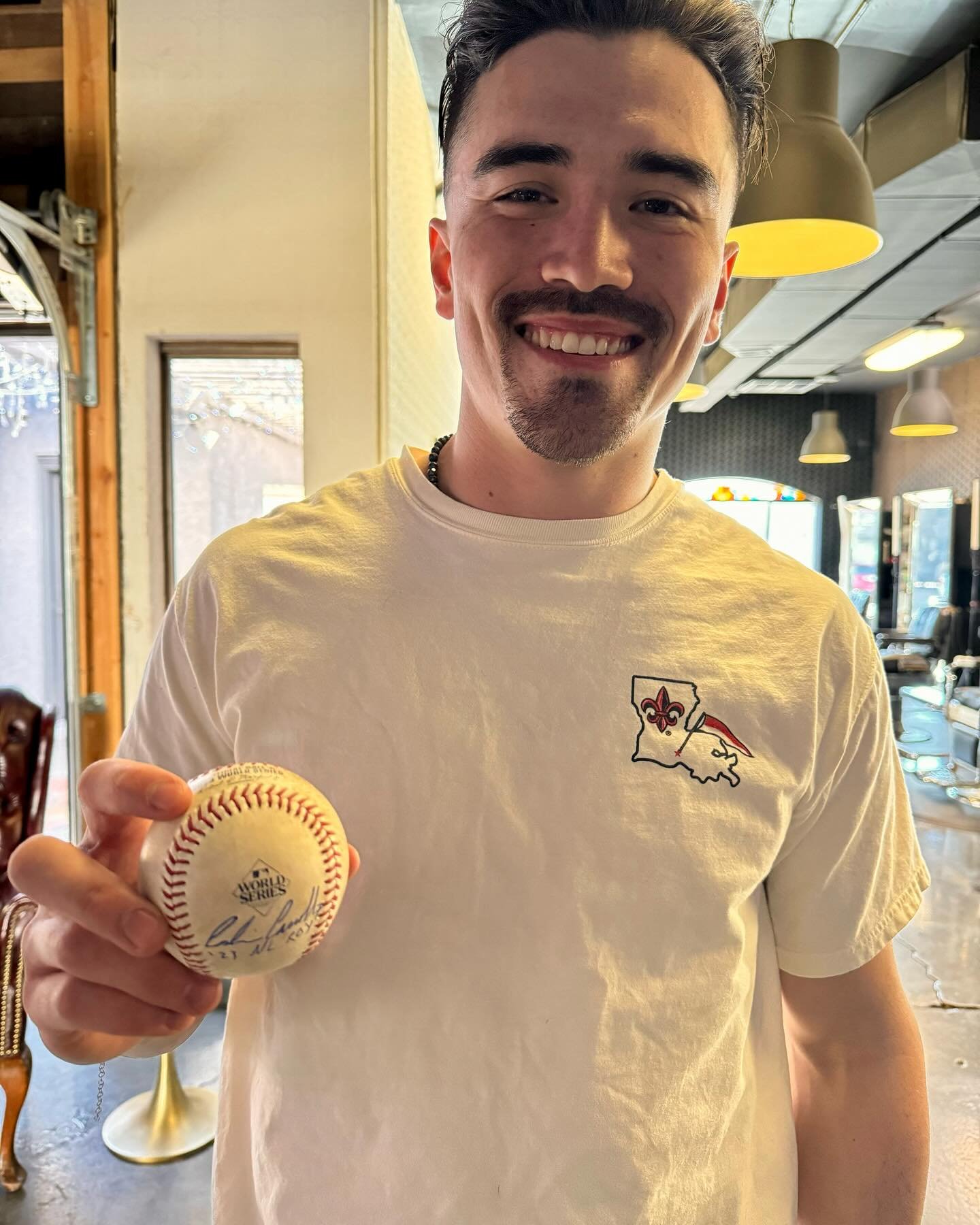 The man himself 🐍 @corbin.carroll 

 Arizona Diamondback NL Rookie of the Year stopped by our Old Town location to start the New Year with a fresh cut! He was so generous to sign a ball caught during World Series game 5 ⚾️