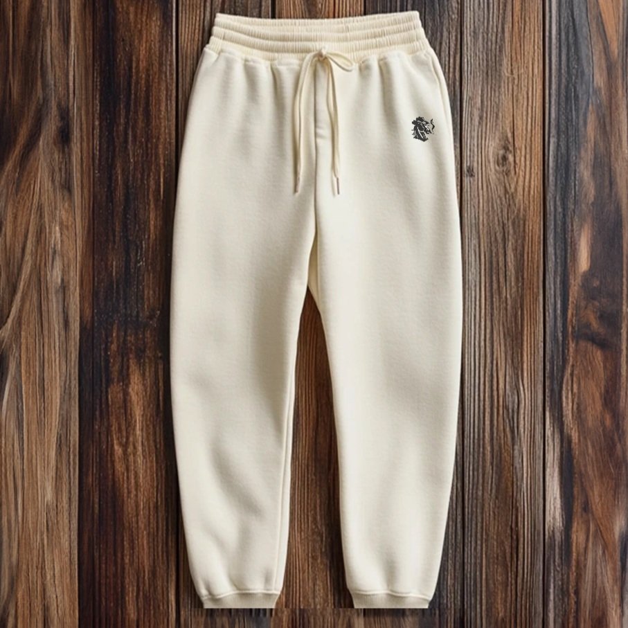 Front view of ivory Rebel Sweats with drawstring waist and cuffed ankles