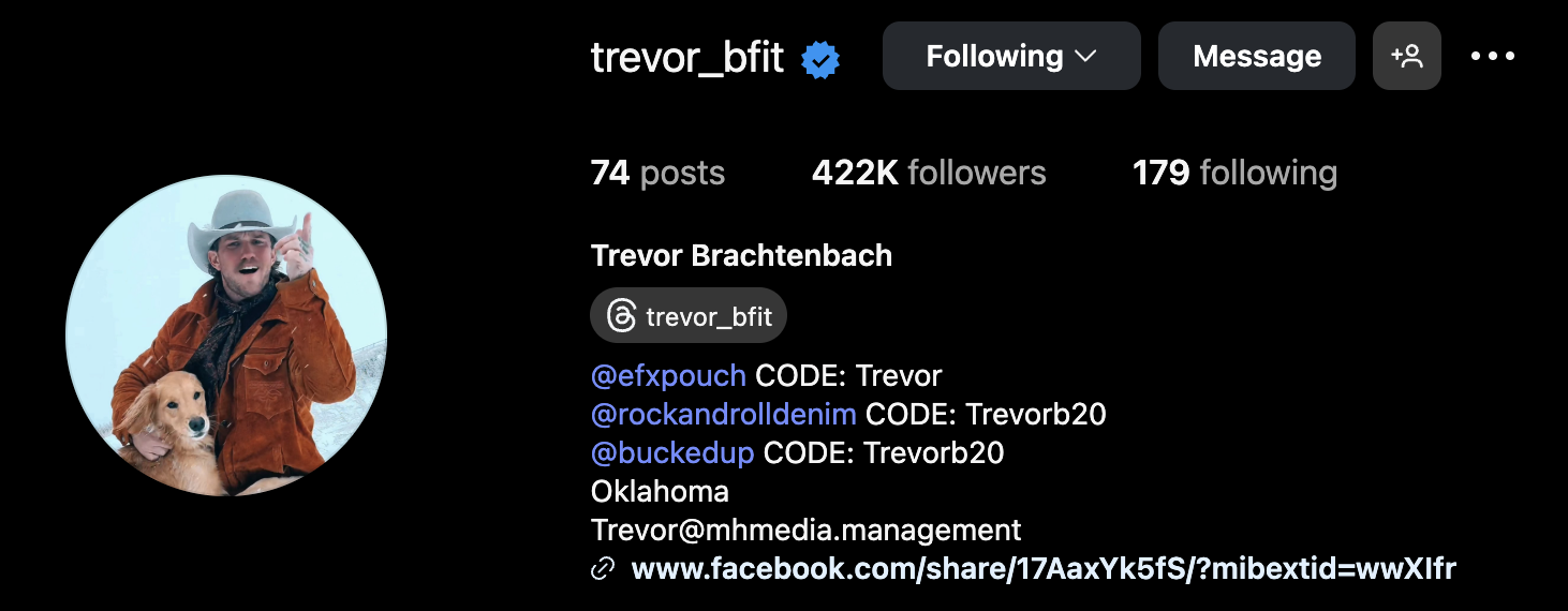 Profile page of Trevor Brachtenbach on social media, including a circular profile picture of a man wearing a cowboy hat, orange jacket, and holding a dog, with follower count and links to merchandise and contact info.