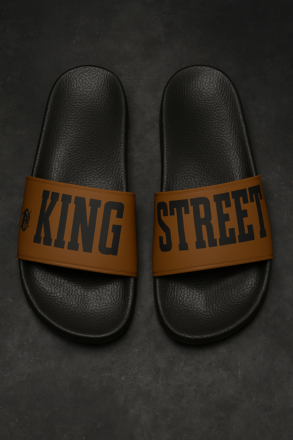 Top-down view of King Street Cowboys slides, black sole with KING STREET text on strap.