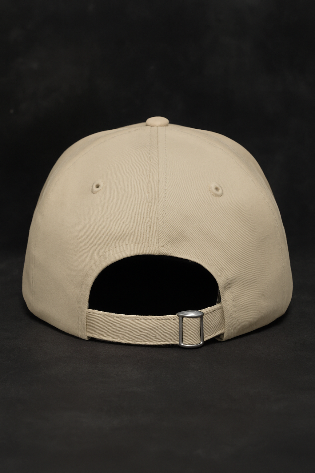 Back view of Rugged Rebel beige baseball cap with adjustable strap.