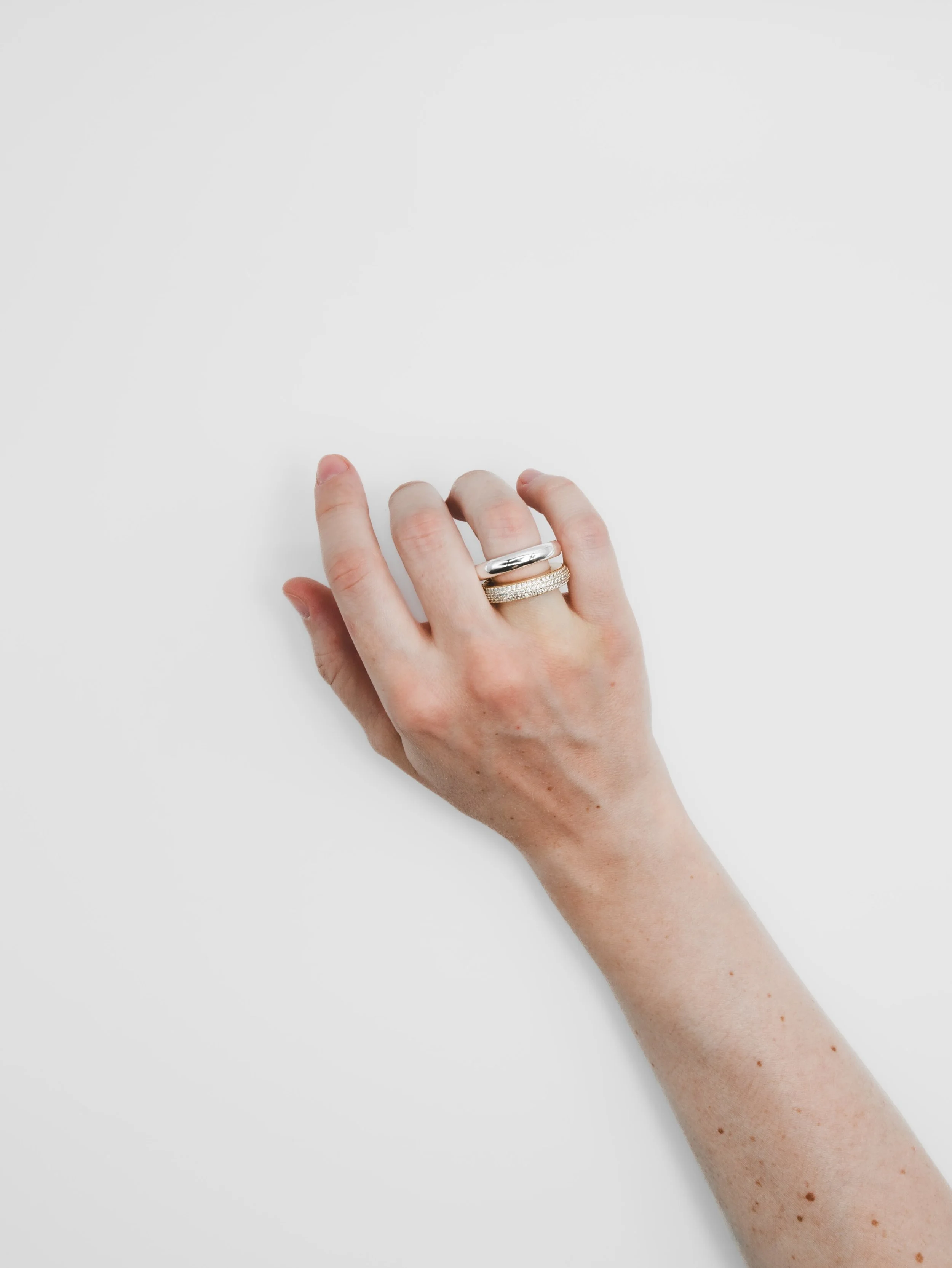 Three finishes, one signature look: The Circular Screw Ring in 925 Sterling Silver, 14k Gold Plated, with or without sparkling zircons.