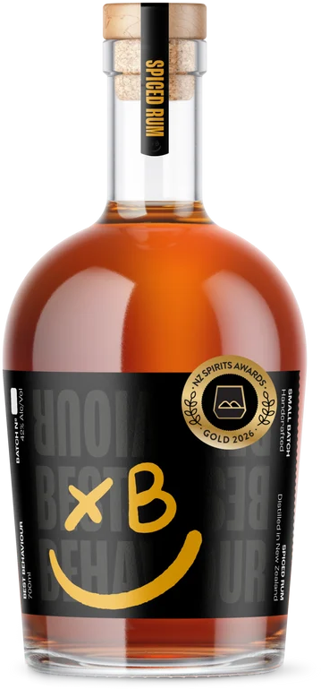 A bottle of Spice Bum liquid with a black label, gold award badge, and a cork stopper labeled 'Spice Bum' at the top.