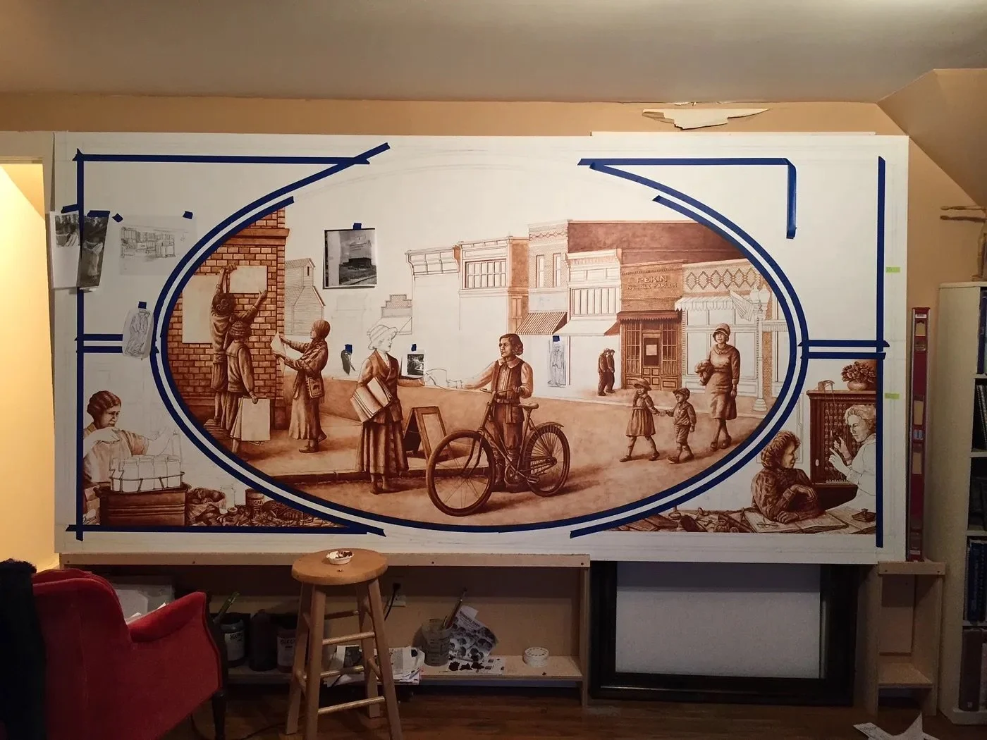 Hadley prepped the two powder-coated aluminum mural panels, sanding and then brushing them with two layers of gesso to create a more textured, uneven surface. Then, she drew the borders that defined the center ovals, triangular corners, and outside e