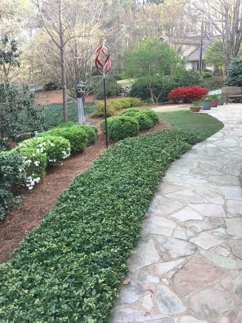 A beautiful garden pathway leading up to the entrance of The American School of Protocol's etiquette training.