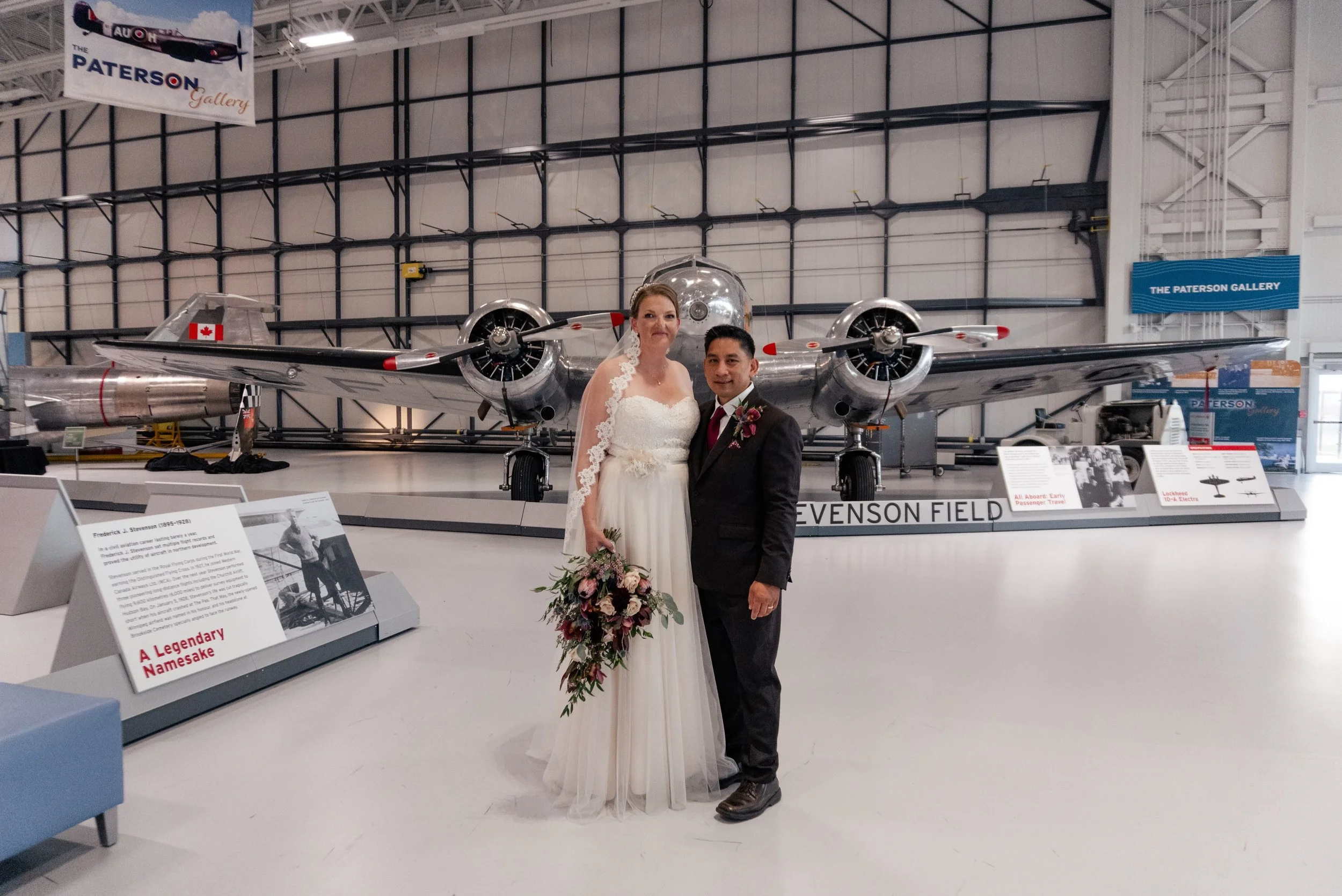 Your venue can become part of the story of your photos.

Annelies and Mike&rsquo;s portrait inside the aviation museum is such a good example of using the setting rather than trying to hide it. The result feels completely specific to their wedding an