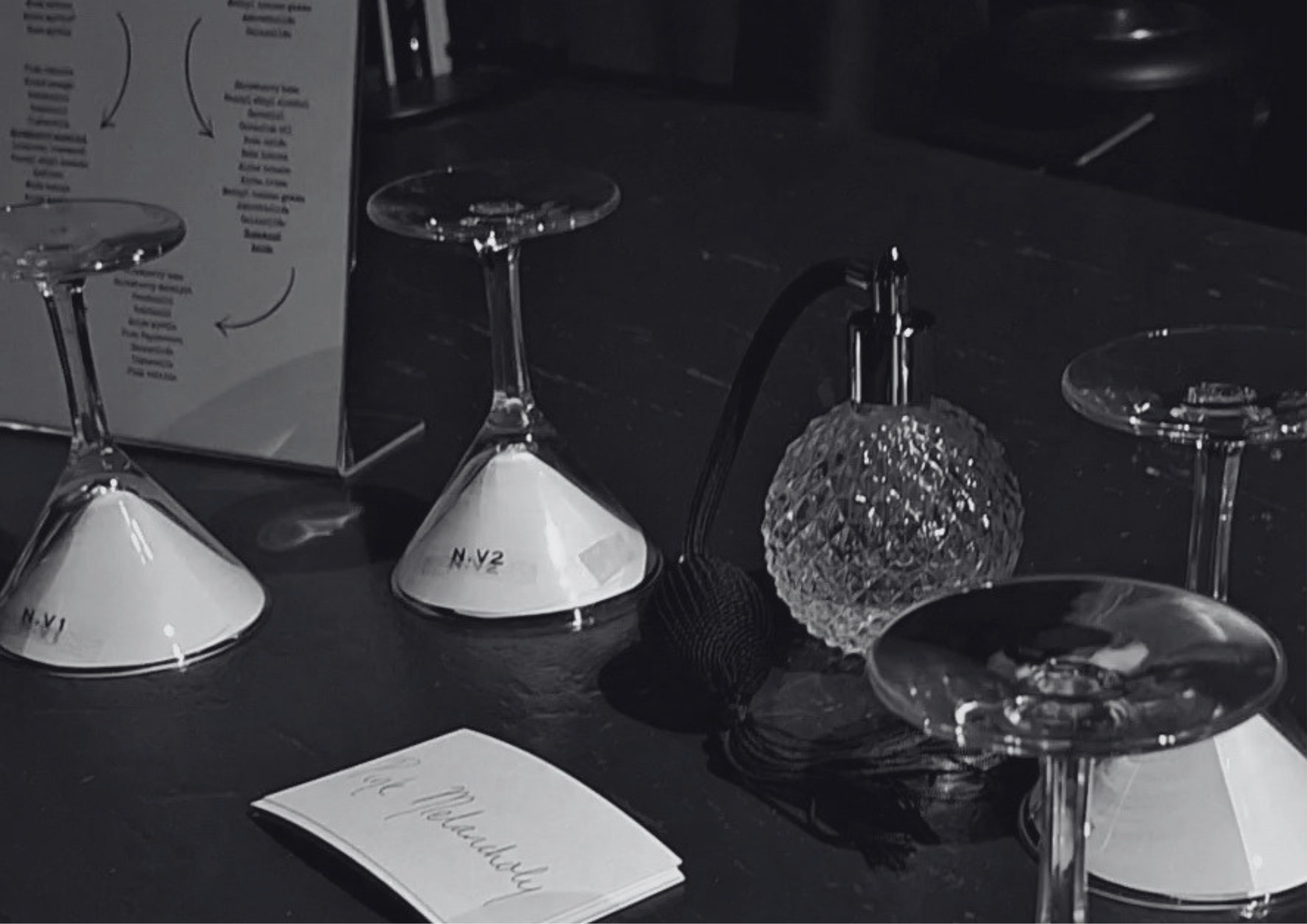 close-up of a display from the Olfactophone exhibition in Tokyo showing an old fashioned perfume bottle