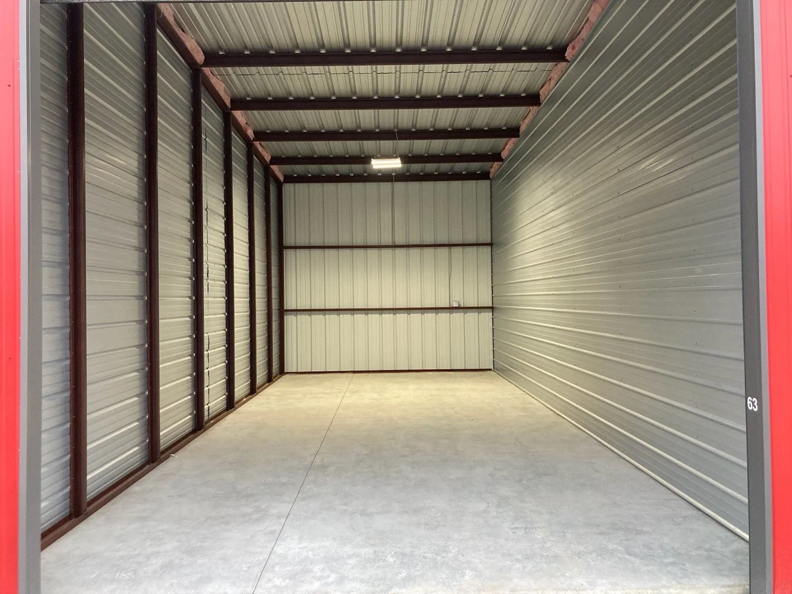 large roll up doors for 936 storage unit for boats and rvs - concrete floors, power in unit, bright lights