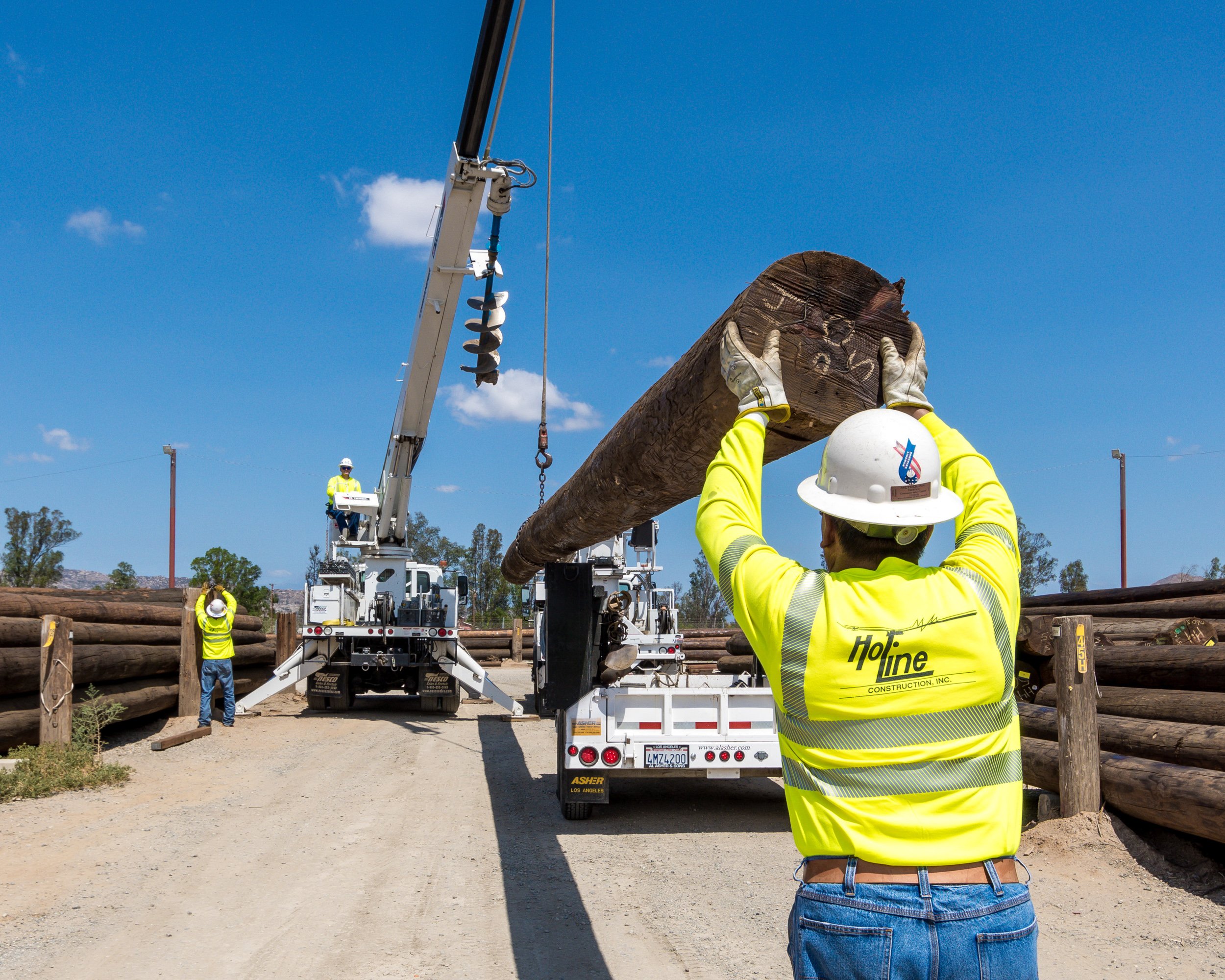 Power line utility workers with OSHA PPE and crane, Stockton, Modesto, Fresno, Central Valley, California
