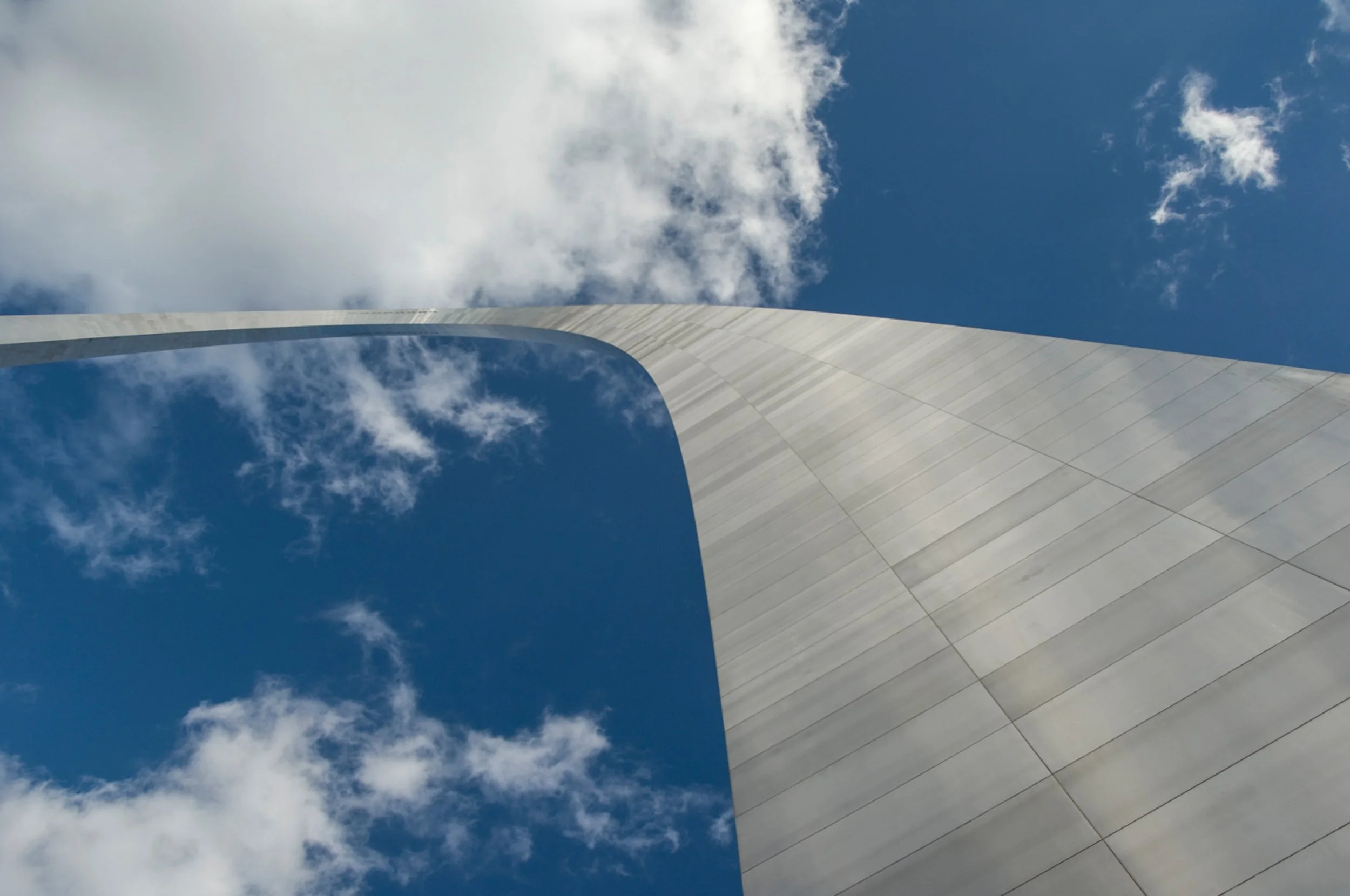 The Gateway Arch against a partly cloudy sky in St. Louis, Missouri.