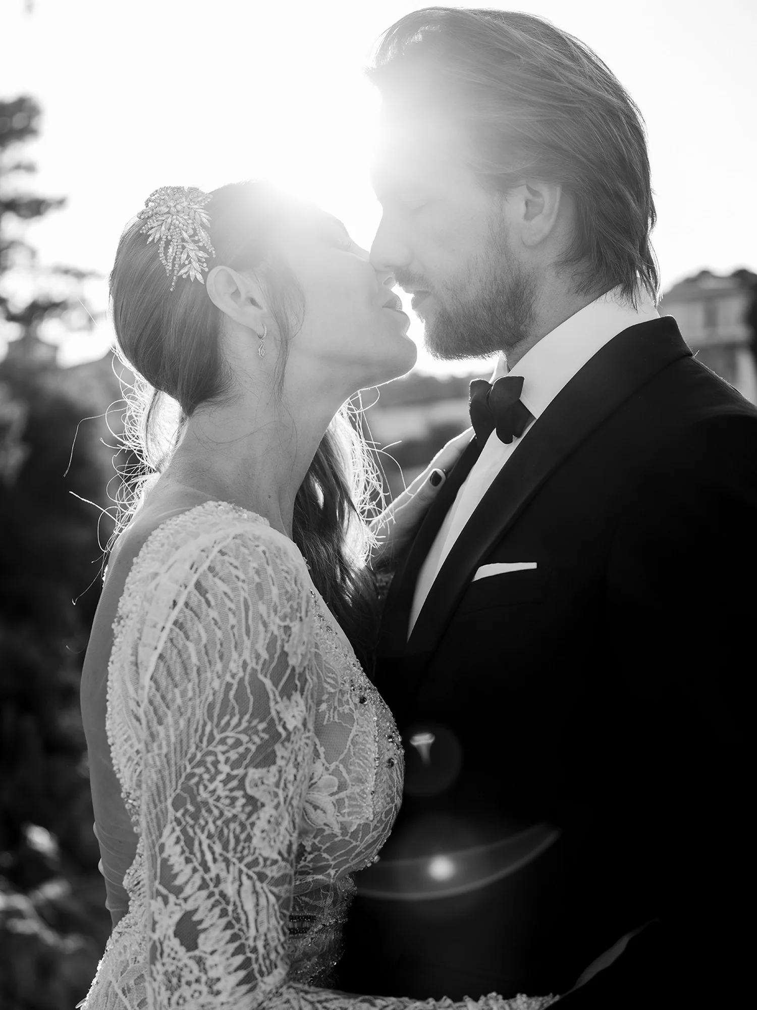 An intimate black and white portrait of a newlywed couple