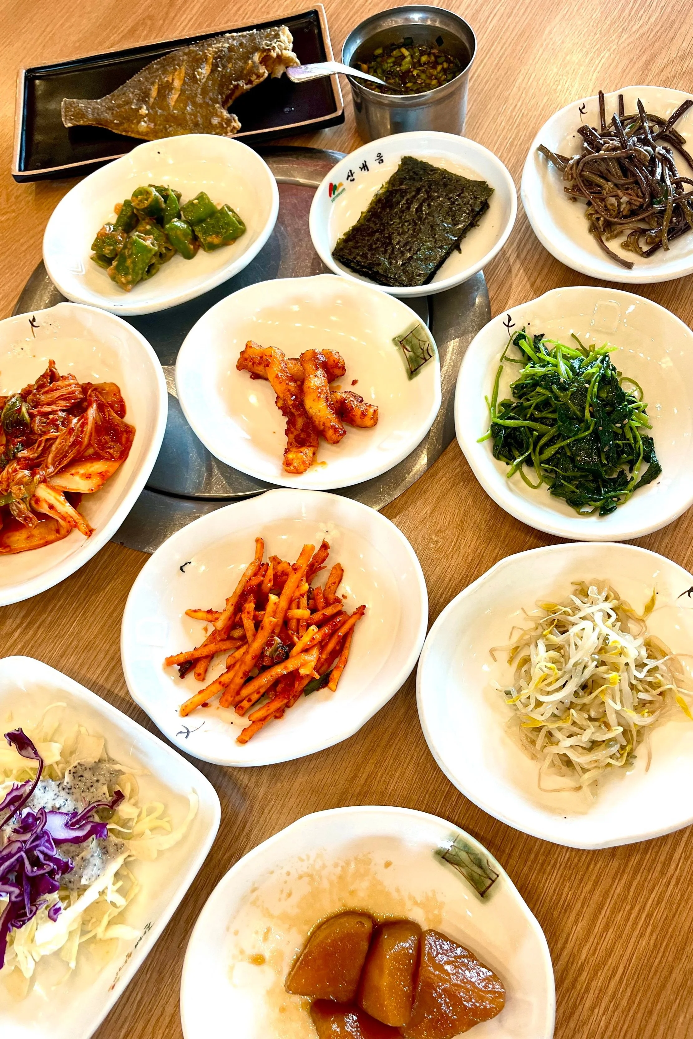 Table filled with side Korean dishes called banchan