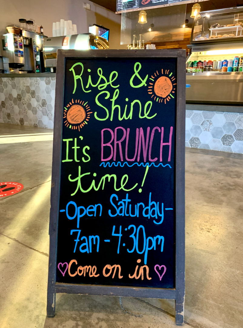 Cafe chalkboard reading "Rise & Shine It's Brunch Time"