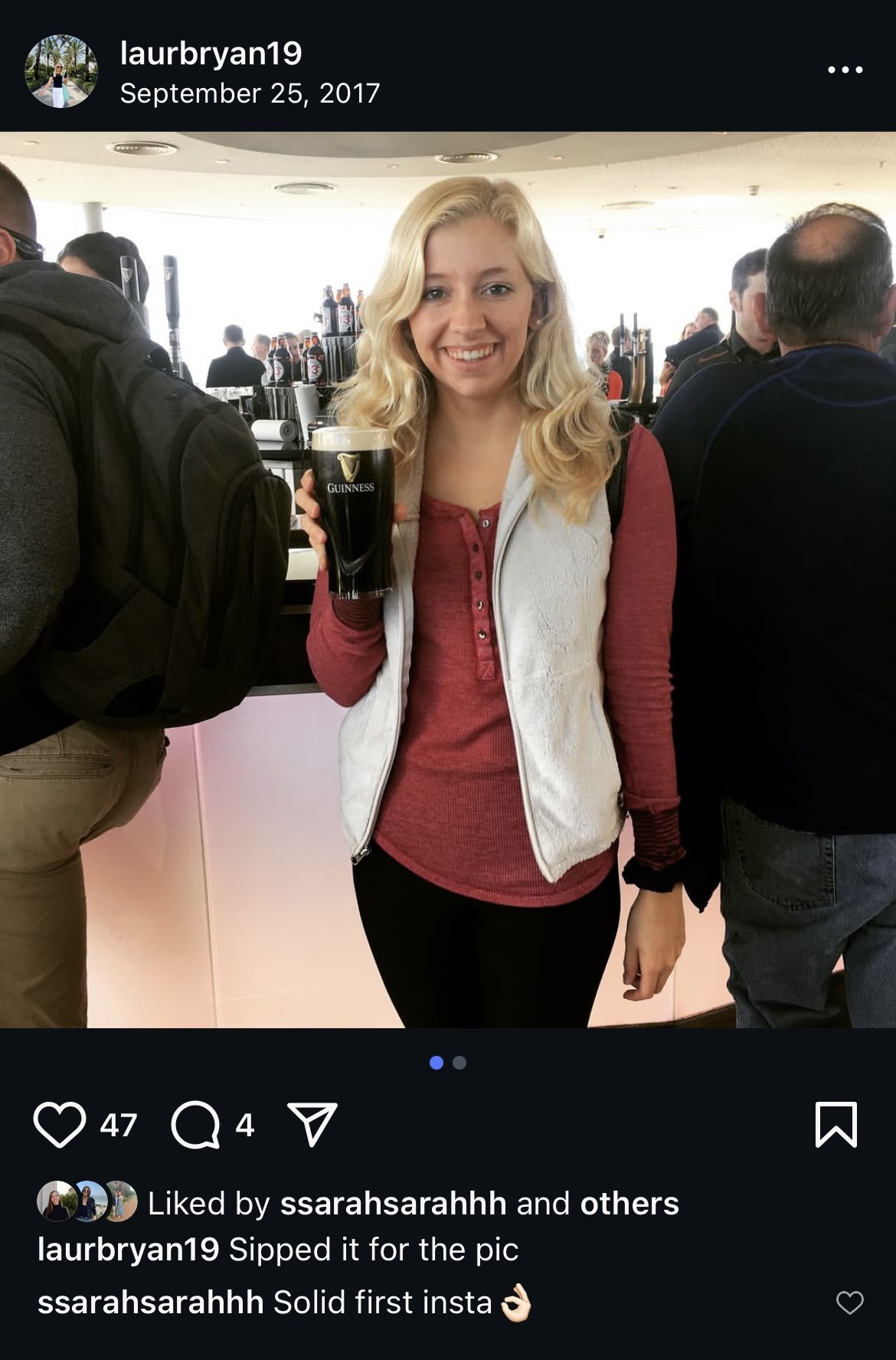 Instagram post of woman posing with a Guinness beer at the Guinness factory in Ireland. Caption "Sipped it for the pic"