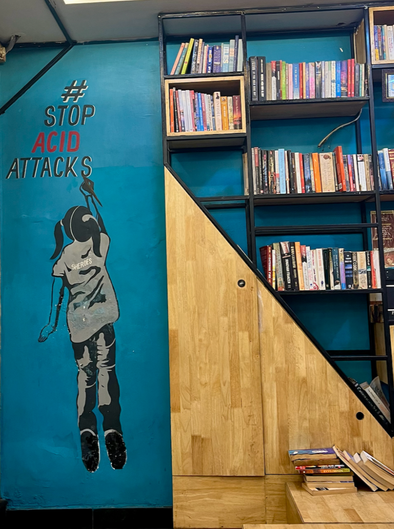 Sheroes Hangout mini library and mural saying #StopAcidAttacks