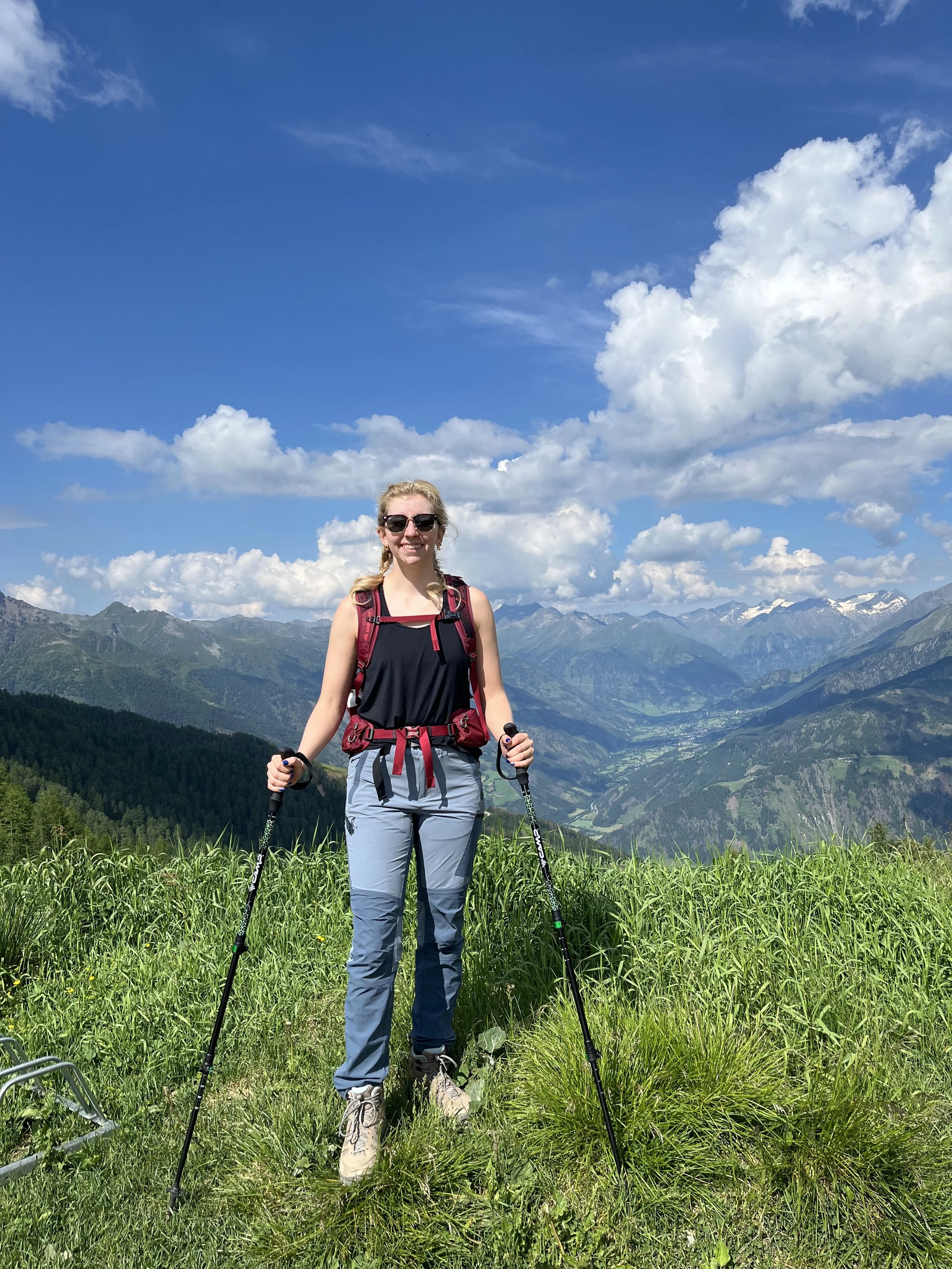 Woman standing on Panorama Trail to Glocknerblick with Austrian Alps in background