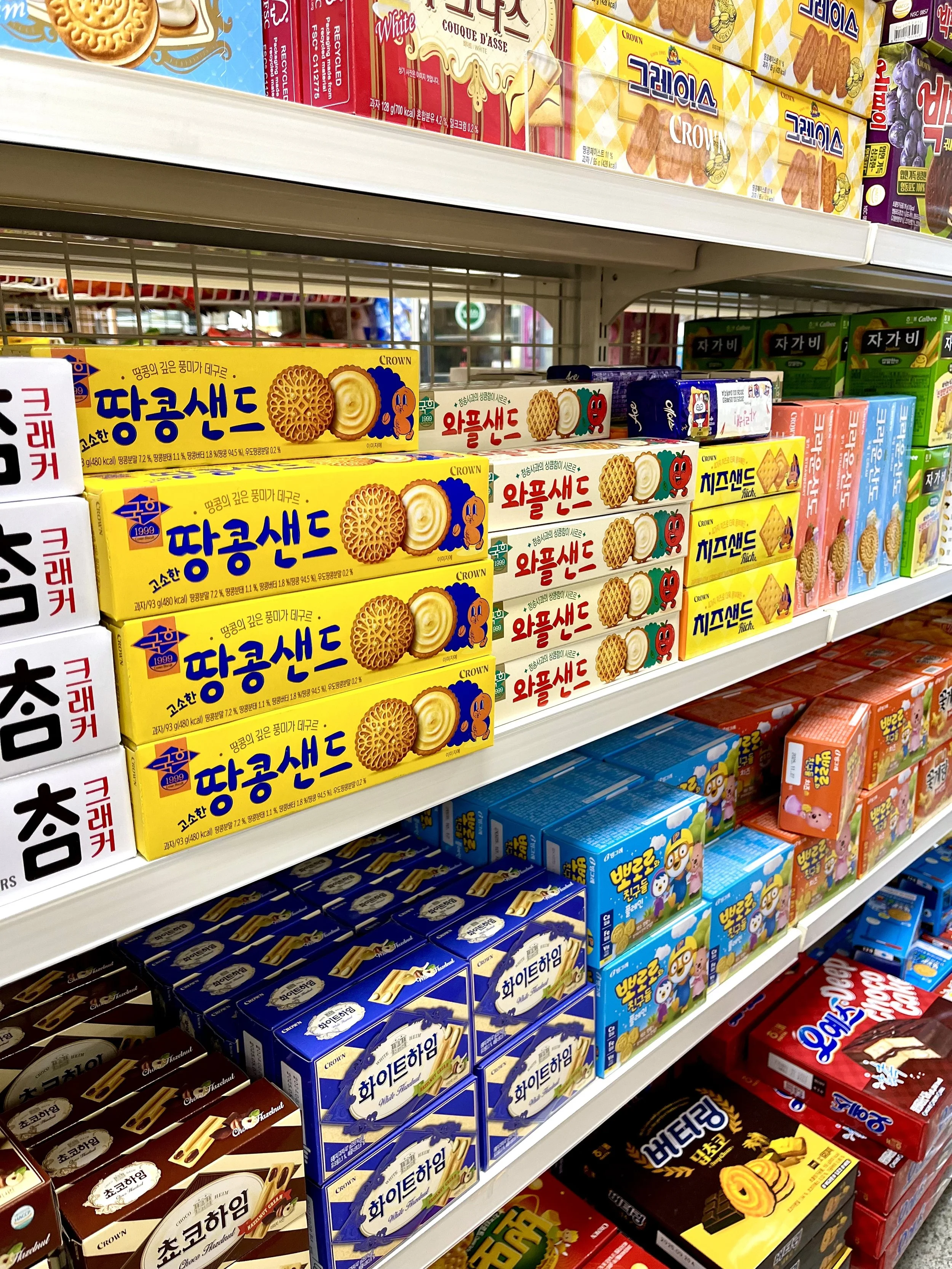 Colorful Korean snacks cookies and crackers on store shelves