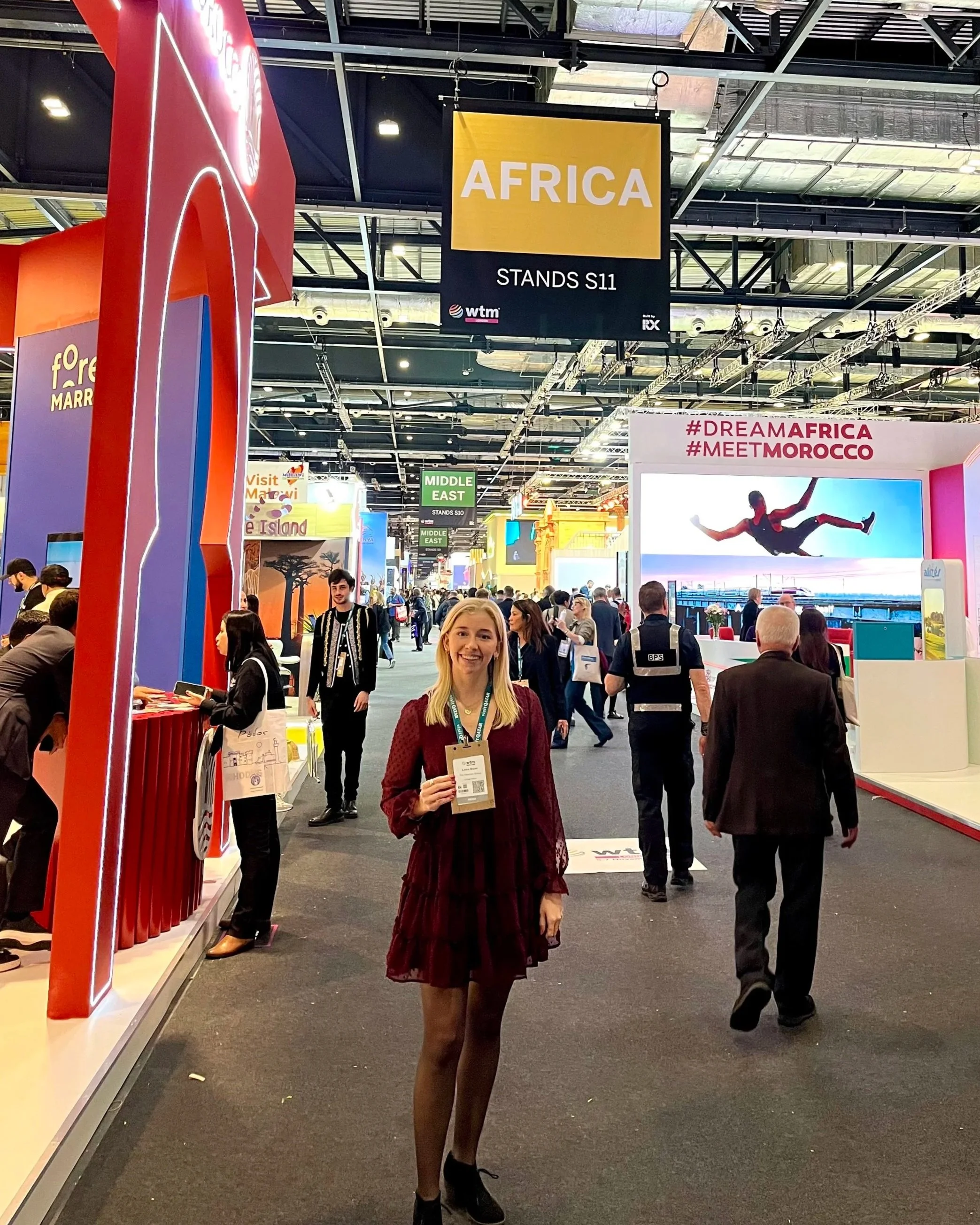 Woman standing in front of travel conference