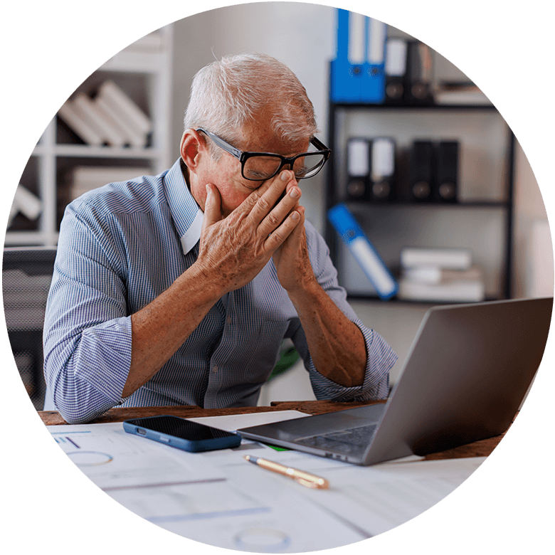Stressed biotech clinical leader reviewing trial updates and CRO performance at desk