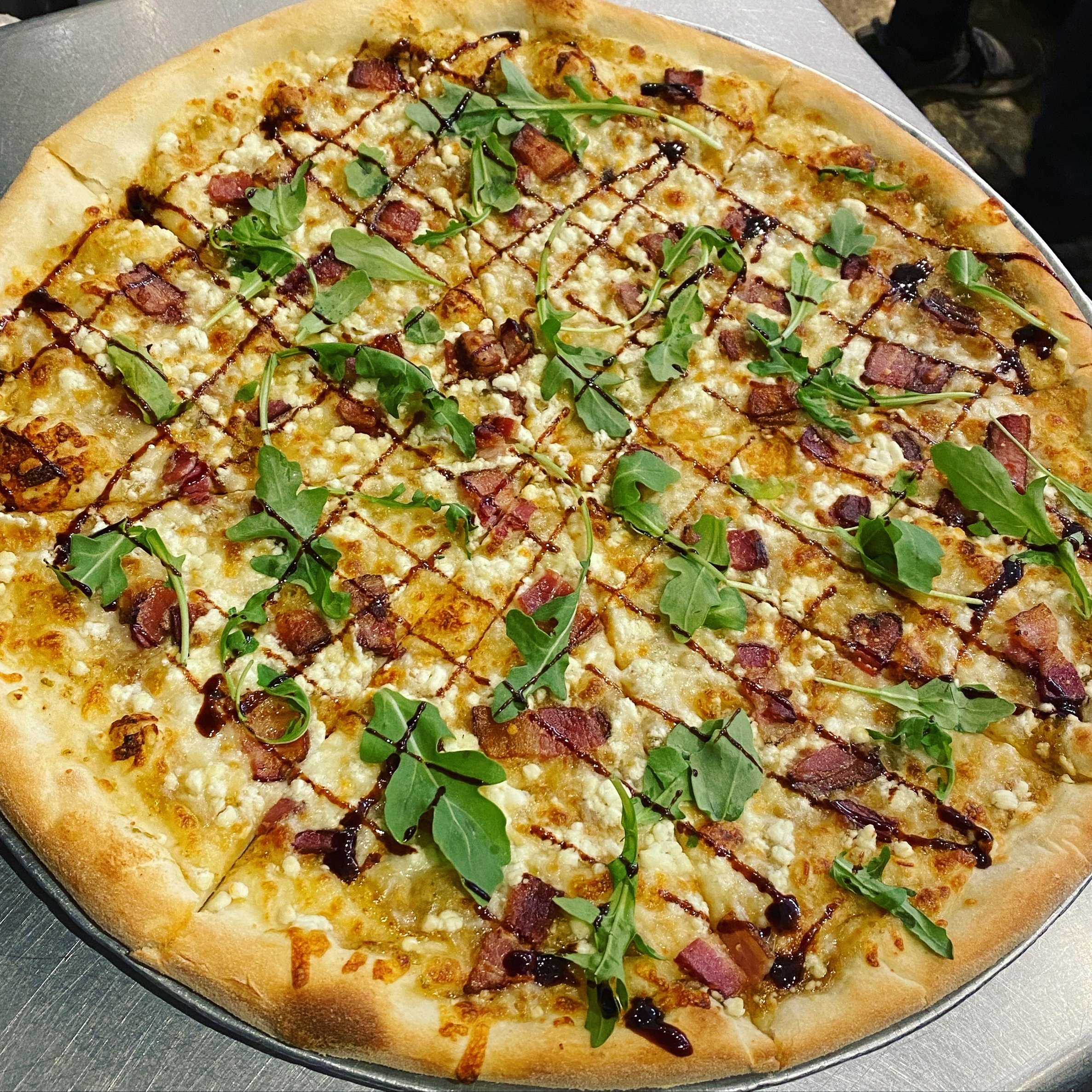 The Big Fig is back! 
All three locations until we run out of Figs.
House made fig jam base, mozzarella, bacon, goat cheese, arugula, and a drizzle of balsamic reduction!