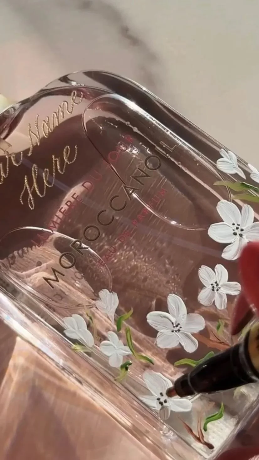 hand-painting-perfume-bottle-floral-detail-moroccanoil-heirloom-ink-studio-brand-collaboration.jpg