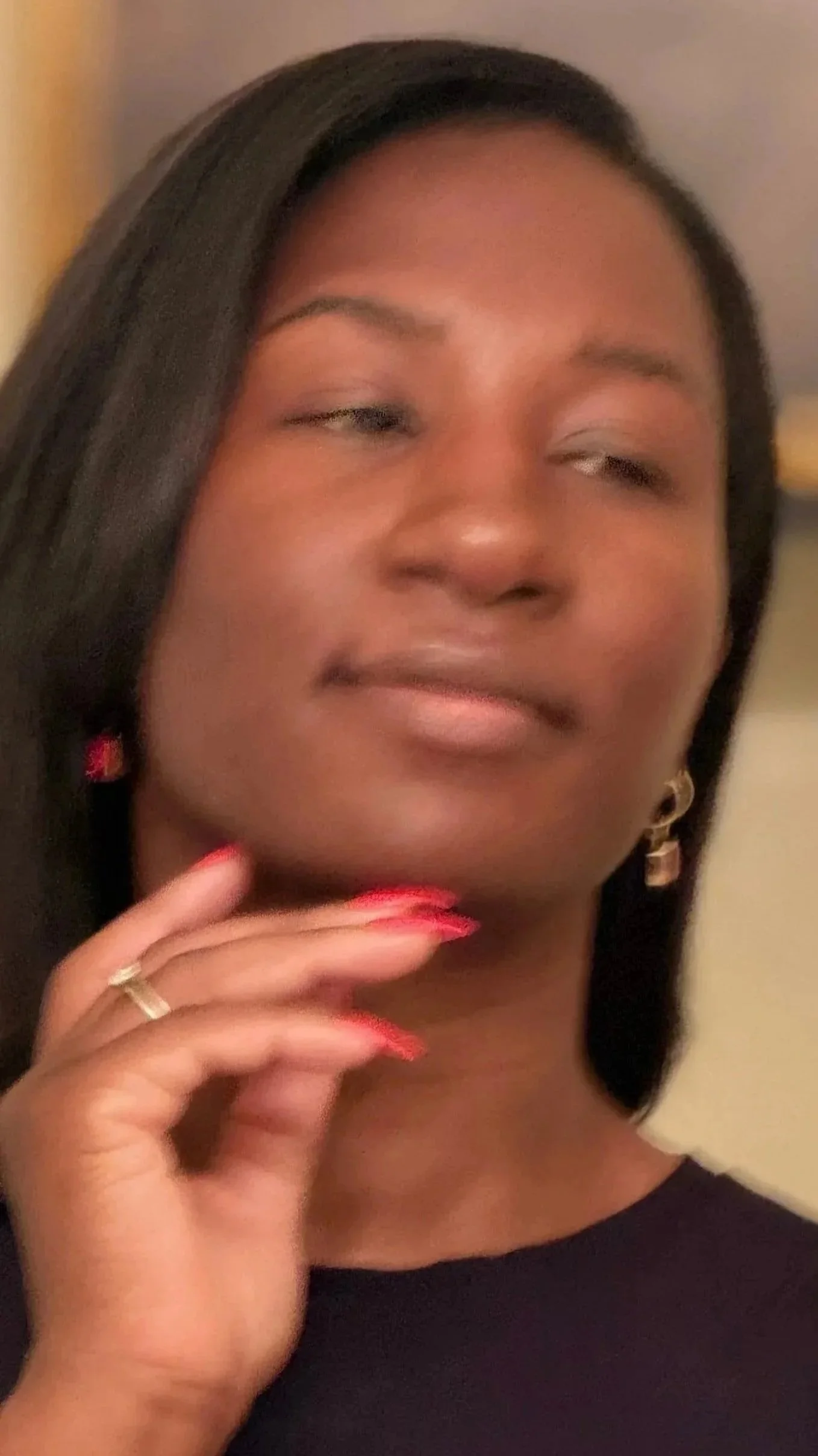 Alishia Nastas, artist and owner of Heirloom Ink Studio, wearing her signature Ferrari red nails.