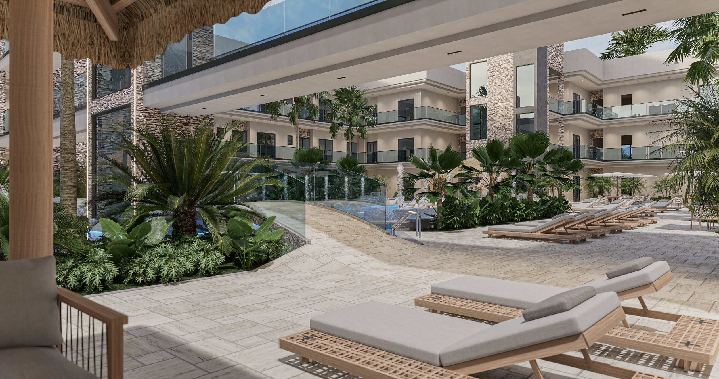 Pool area of a modern residential complex with lounge chairs, lush green plants, and palm trees, featuring a swimming pool with steps and a water feature.