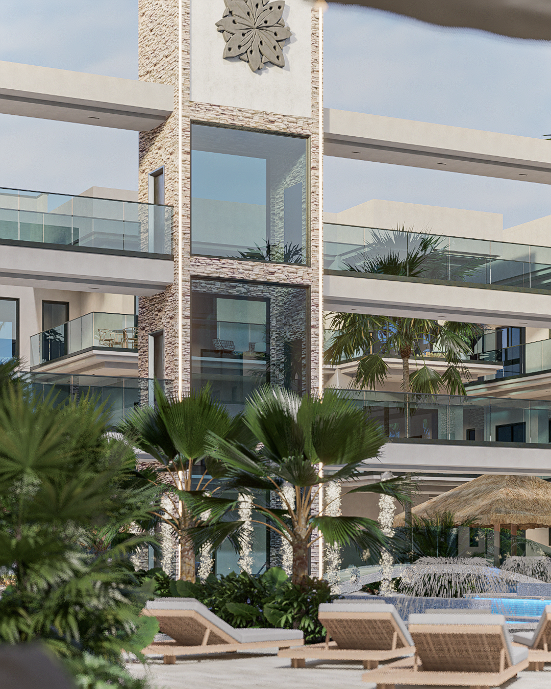 Modern multi-story building with glass balconies, surrounded by palm trees and poolside lounge chairs.