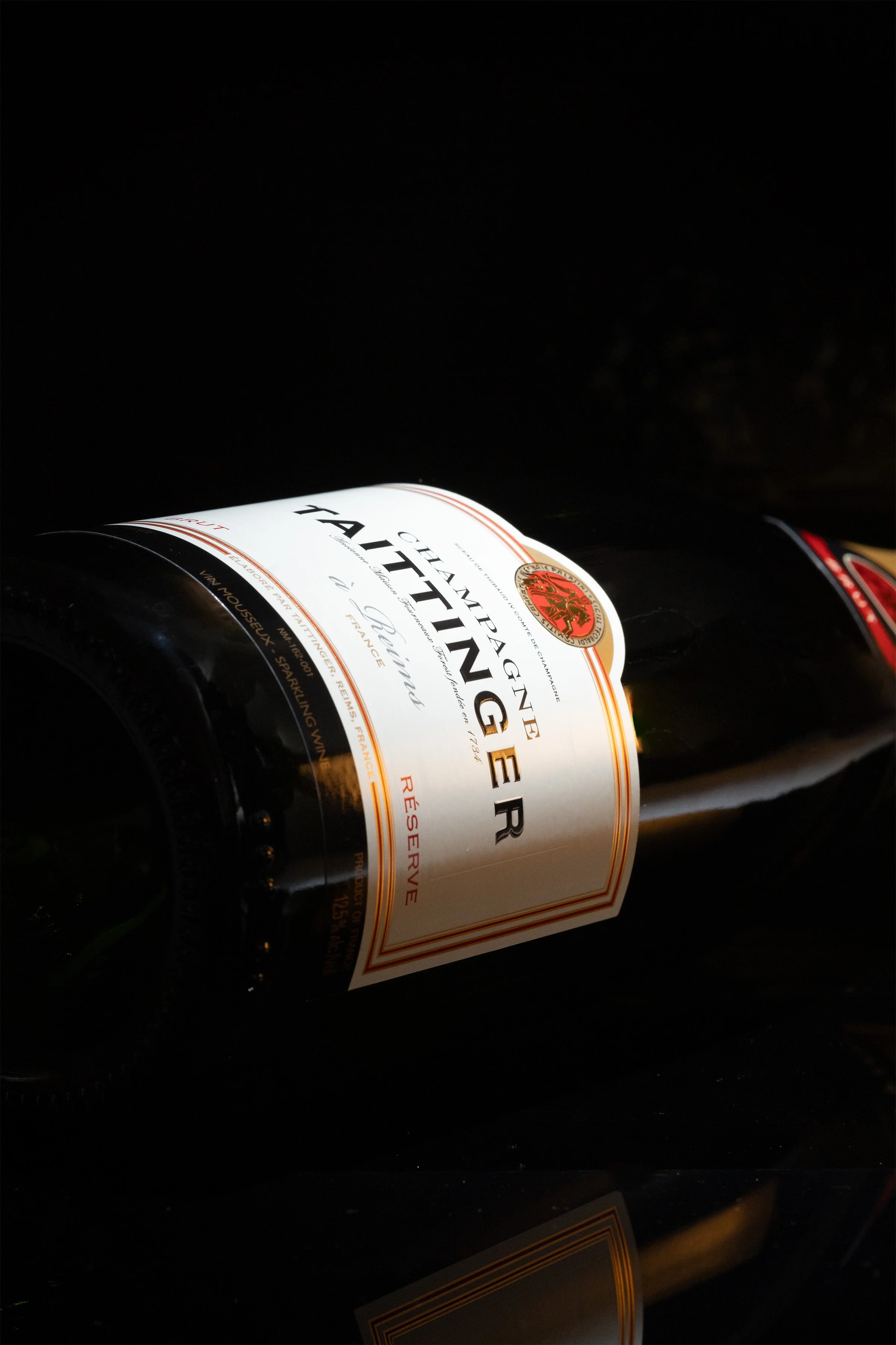 Close up image of a bottle of Taittinger Champagne
