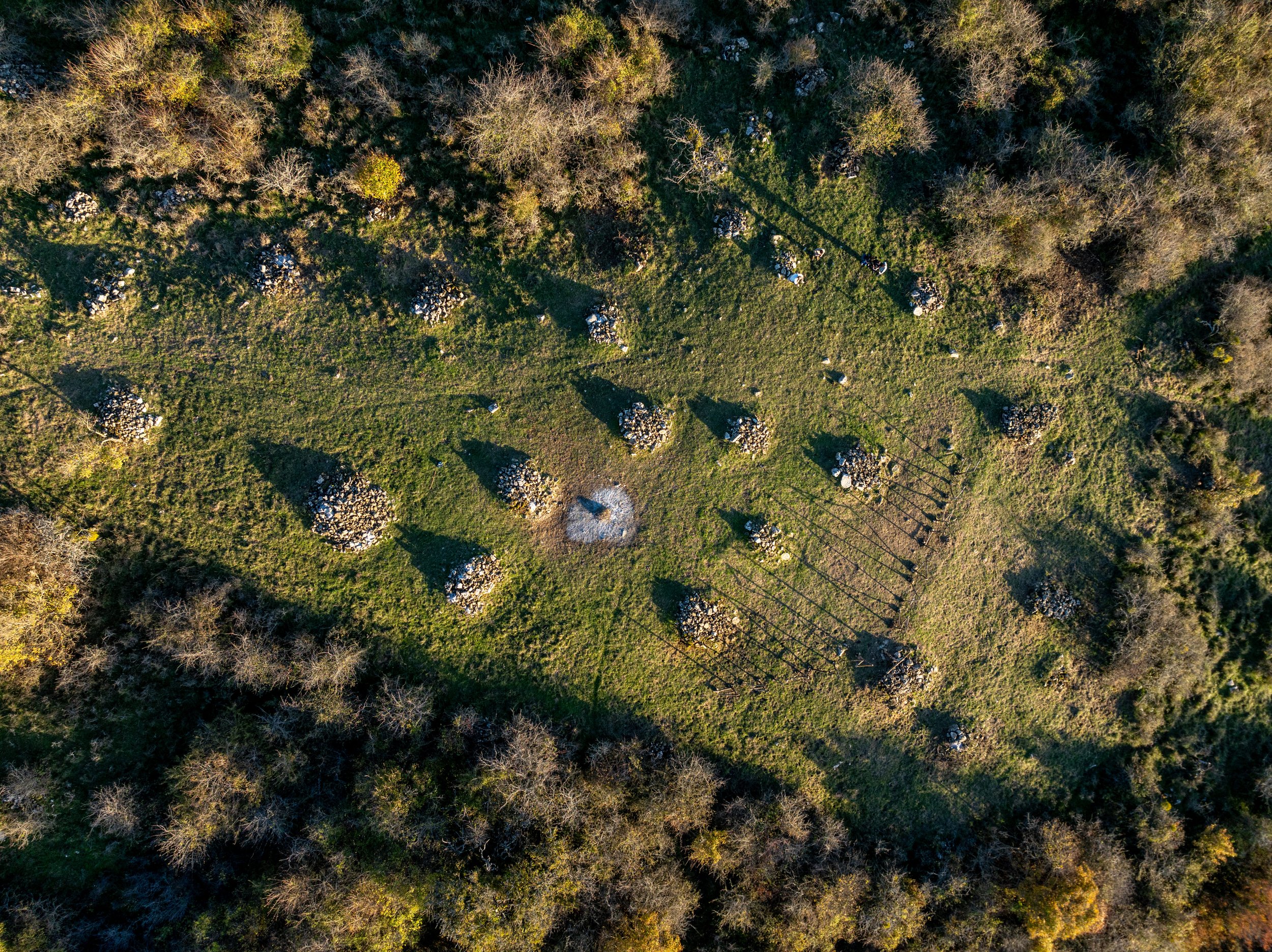 'Tradurre/Tradire', 2024, wood, 1600 x 320 x 30 cm. Aerial drone vertical view, Panario, Roccalbegna, Tuscany, Italy