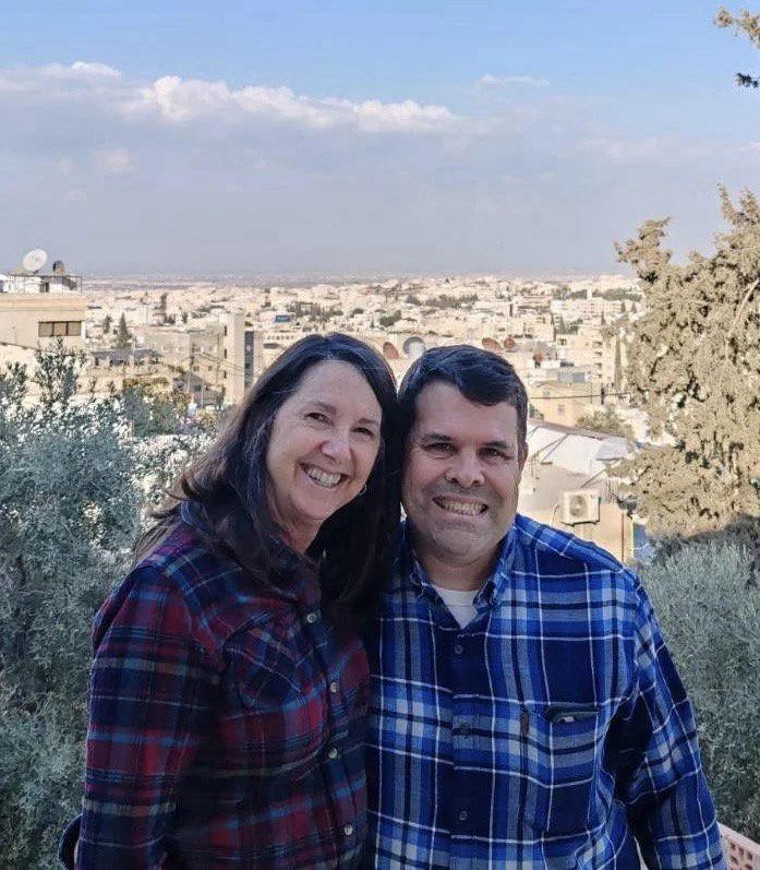 Suzanne and David smiling outdoors