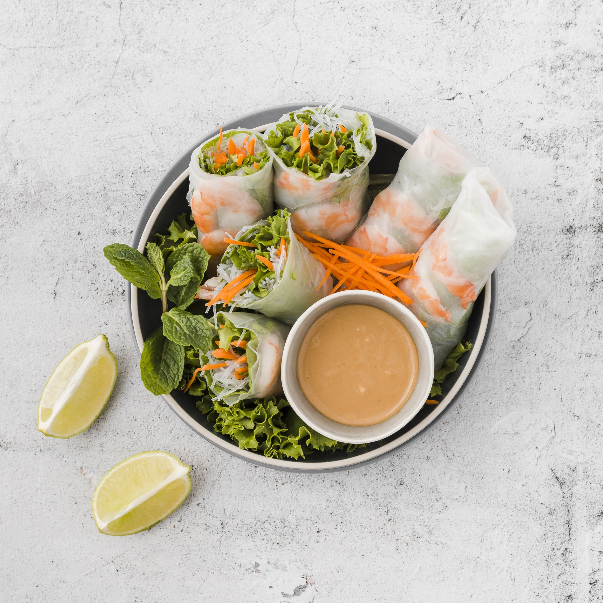 bowl-shrimp-rolls-with-sauce-lemon-slices.jpg