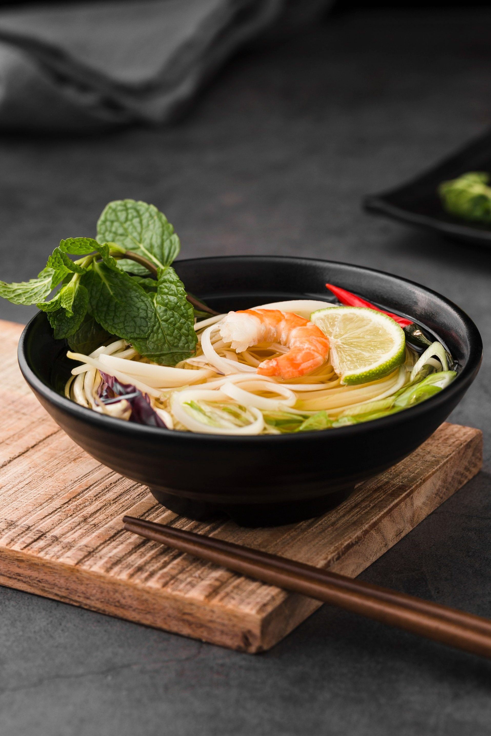 high-angle-soup-with-noodles-chopsticks.jpg