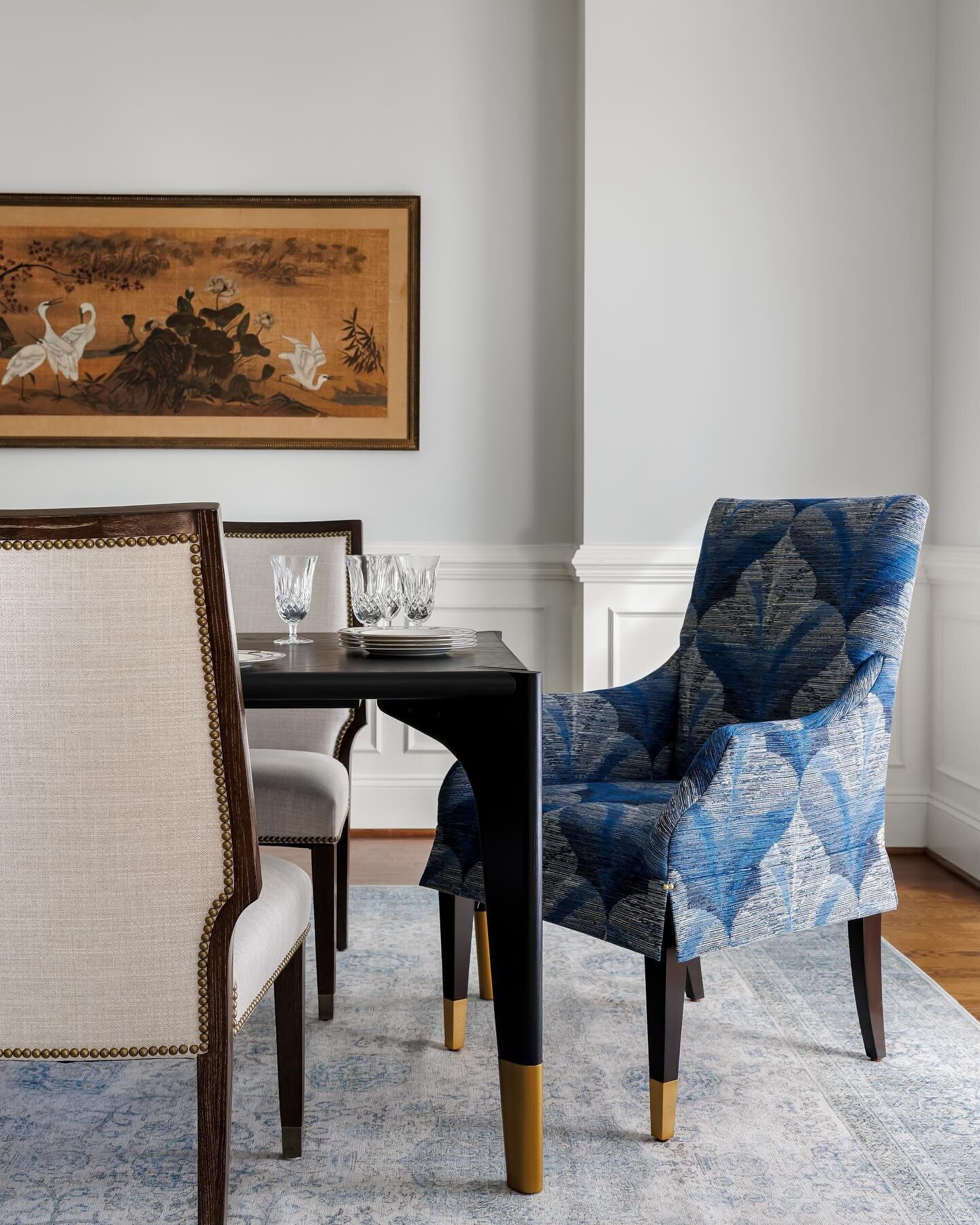 The pattern on this chair stole our hearts and now it steals the scene in this dining room that we designed for beauty, comfort and function. These same chairs can easily be moved to the other end of the room for use at a little game table in the bay