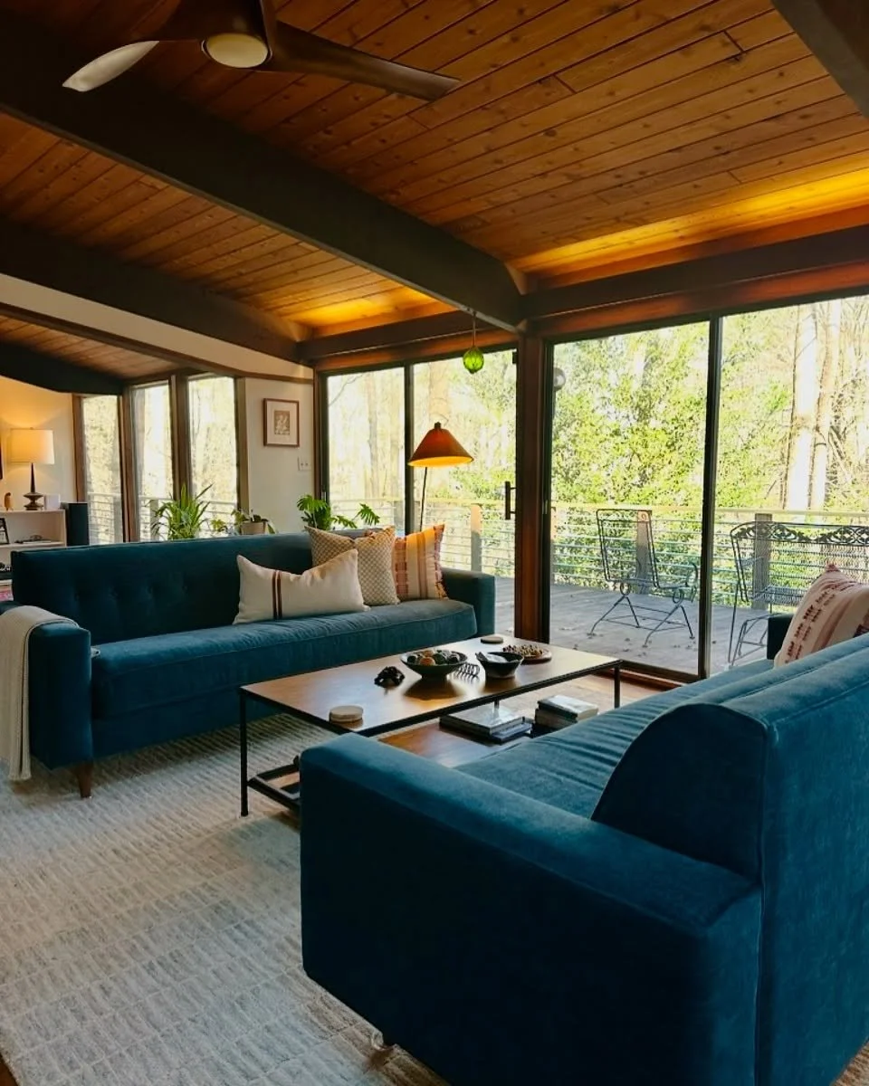When your home is one big open space, layout is everything. In this stunning mid-century home, we helped our clients transform an expansive open floor plan into distinct, cozy zones without adding walls. 

This inviting conversation area is anchored 