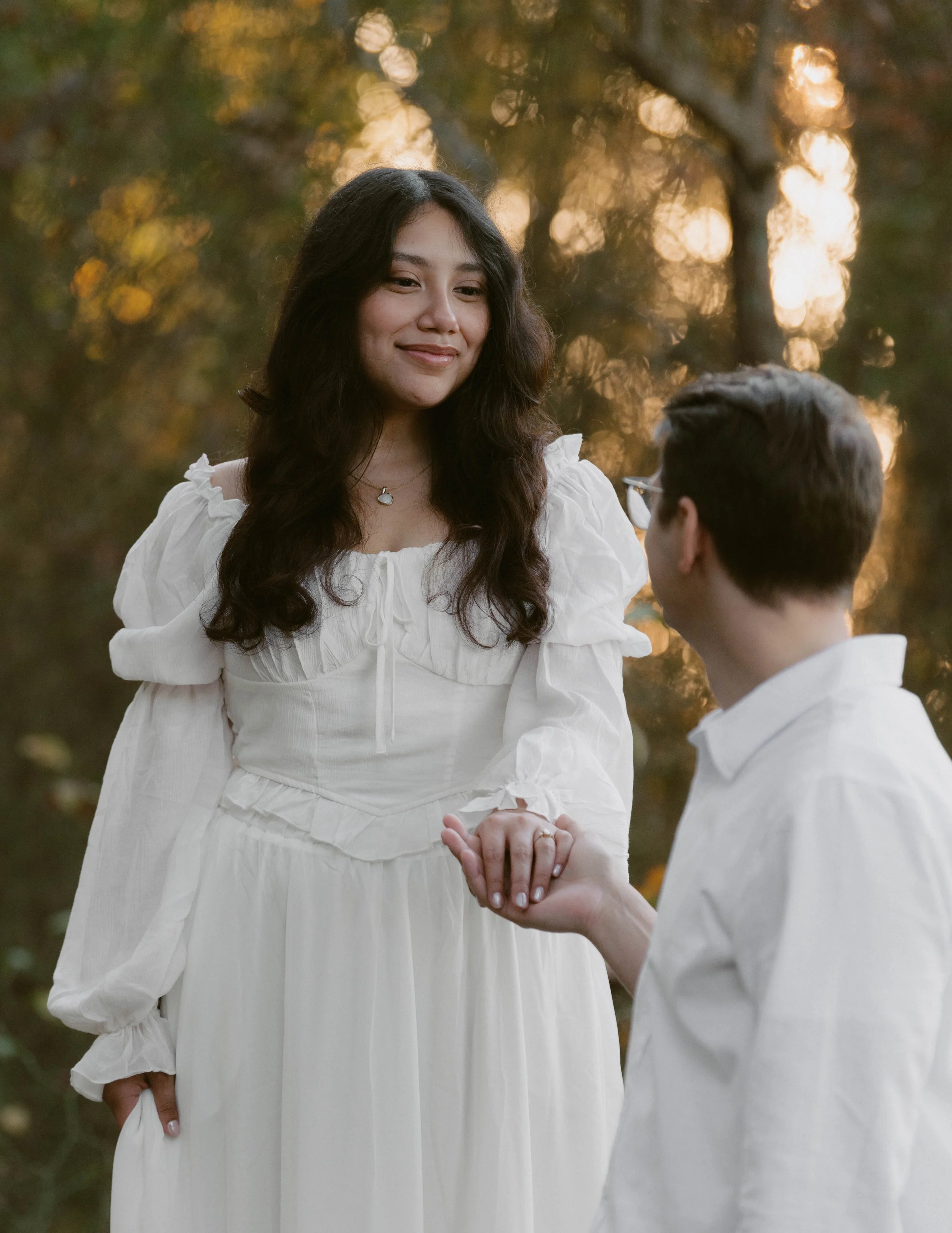 Engaged couple holding hands during a film-inspired engagement session in Southern Maryland.